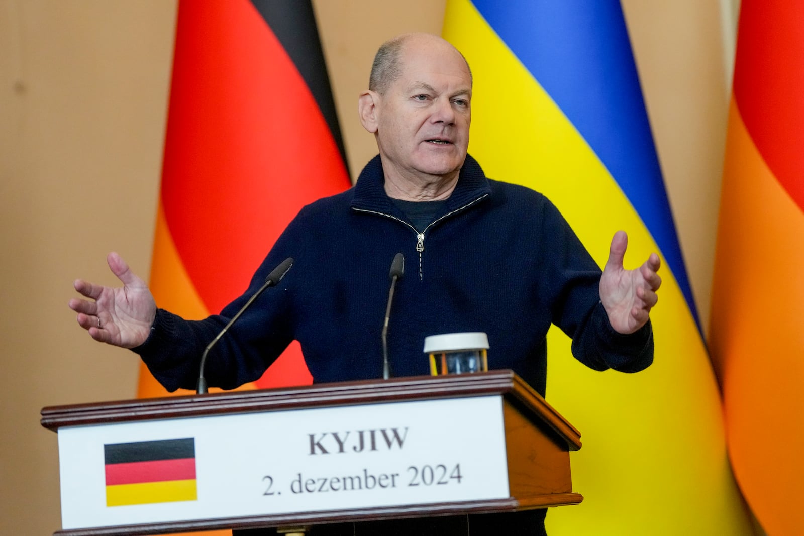 German Chancellor Olaf Scholz attends a press conference in Kyiv, Ukraine, Monday, Dec.2, 2024. (AP Photo/Evgeniy Maloletka)