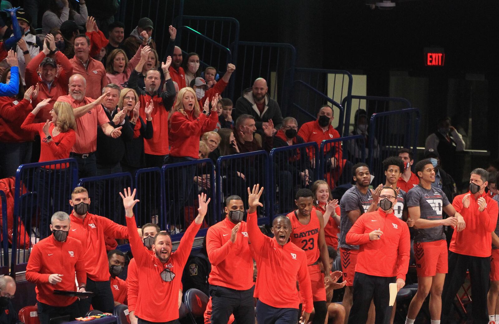 Dayton coaches, players and fans react after a score against Duquesne on Saturday, Jan. 15, 2022, at UMPC Cooper Fieldhouse in Pittsburgh, Pa. David Jablonski/Staff