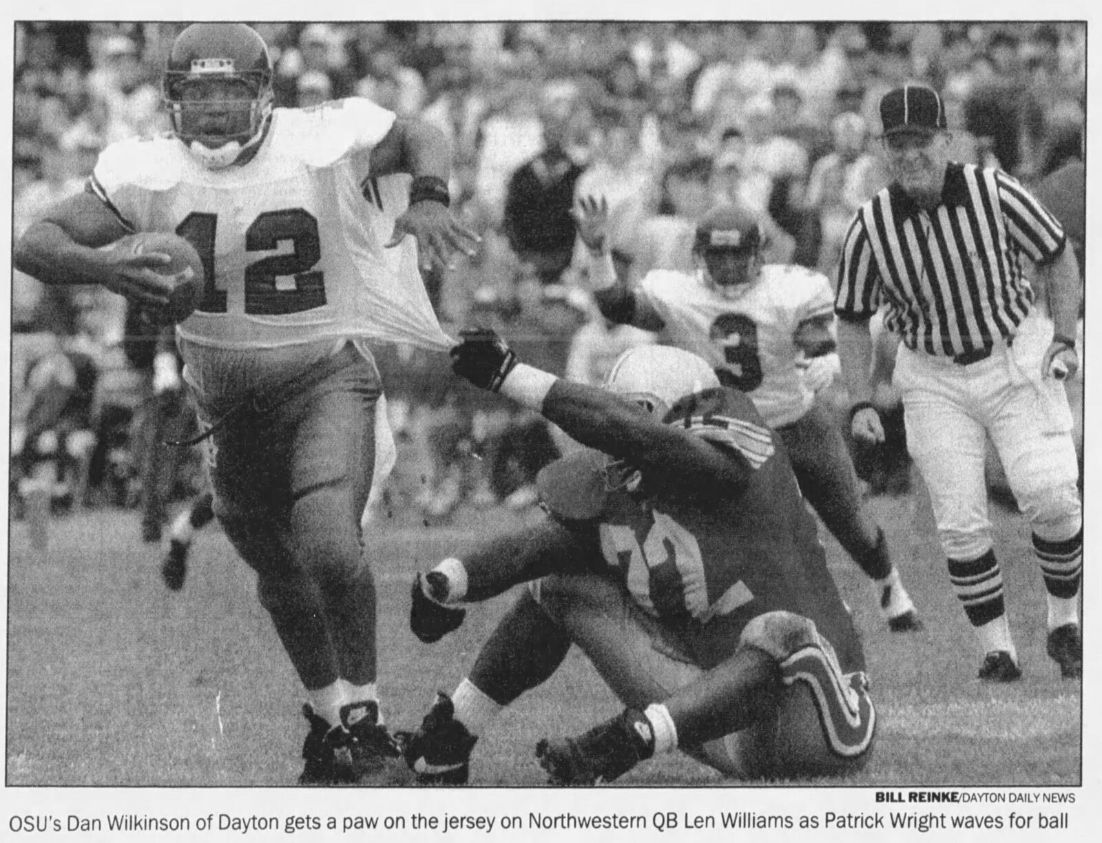 OSU's Dan Wilkinson attempts to make a tackle during a game in 1993. DAYTON DAILY NEWS ARCHIVES.