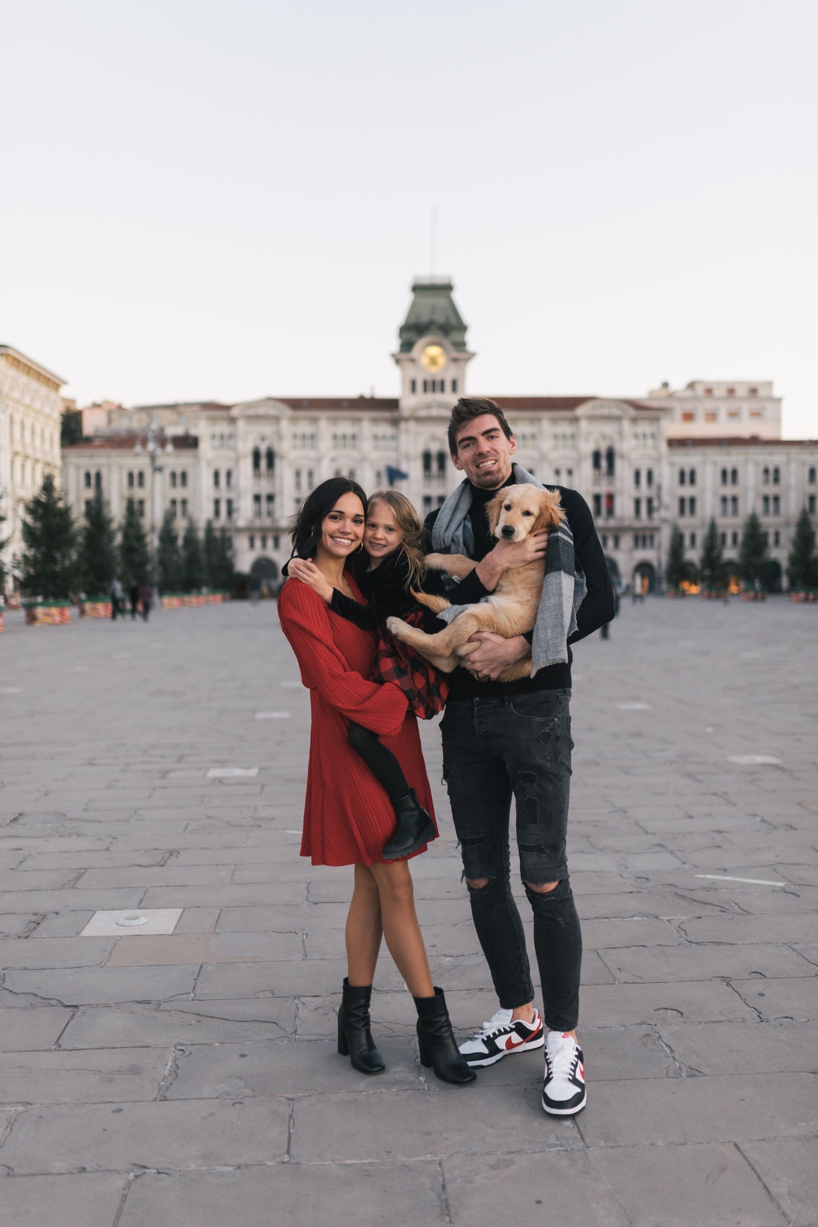 A.J. Pacher and his wife, Abigail, with their daughter, Addisen, and the family dog in Italy. CONTRIBUTED