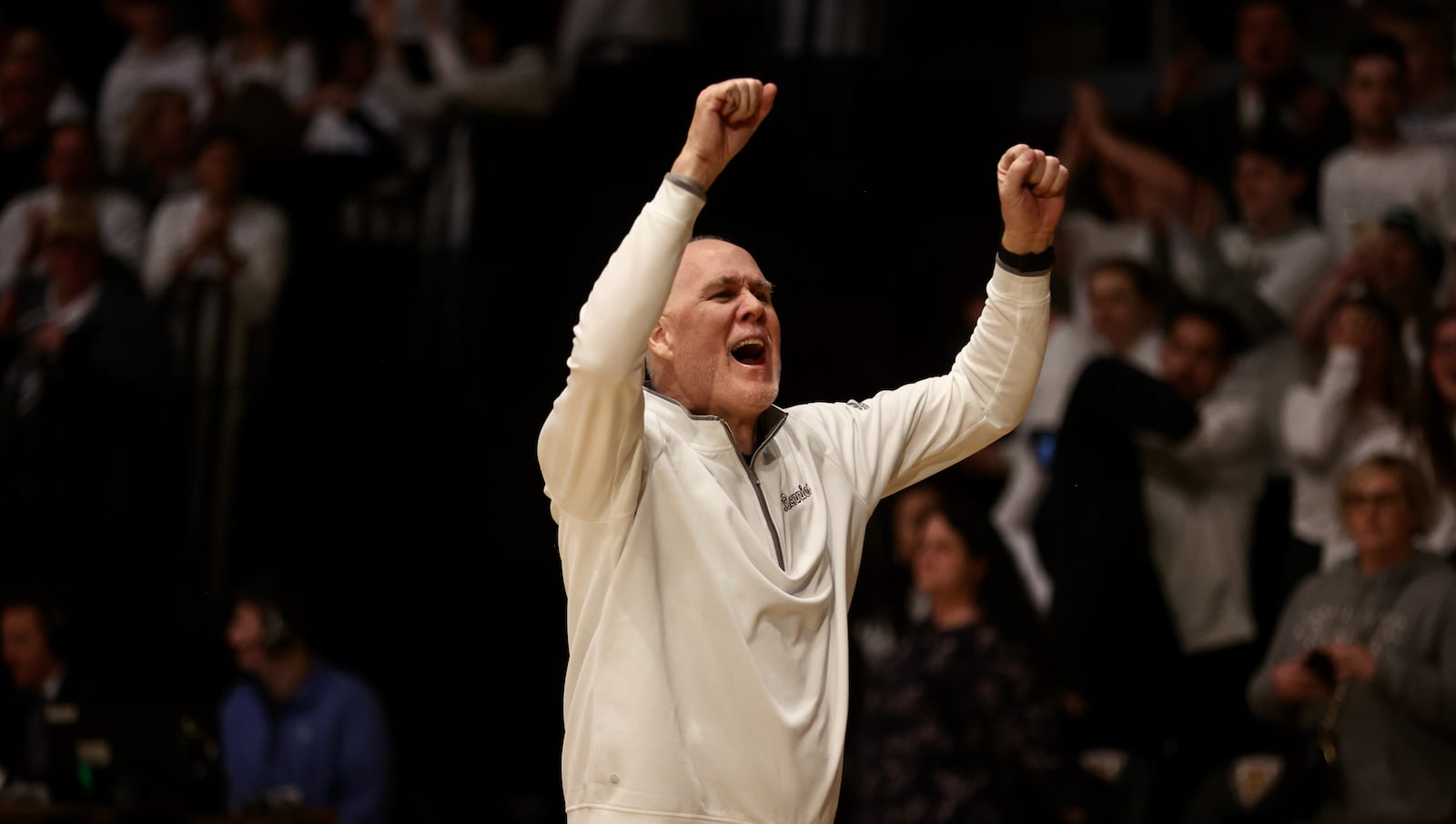 St. Bonaventure coach Mark Schmidt celebrates a victory against Dayton on Saturday, Feb. 4, 2023, at the Reilly Center in St. Bonaventure, N.Y. David Jablonski/Staff