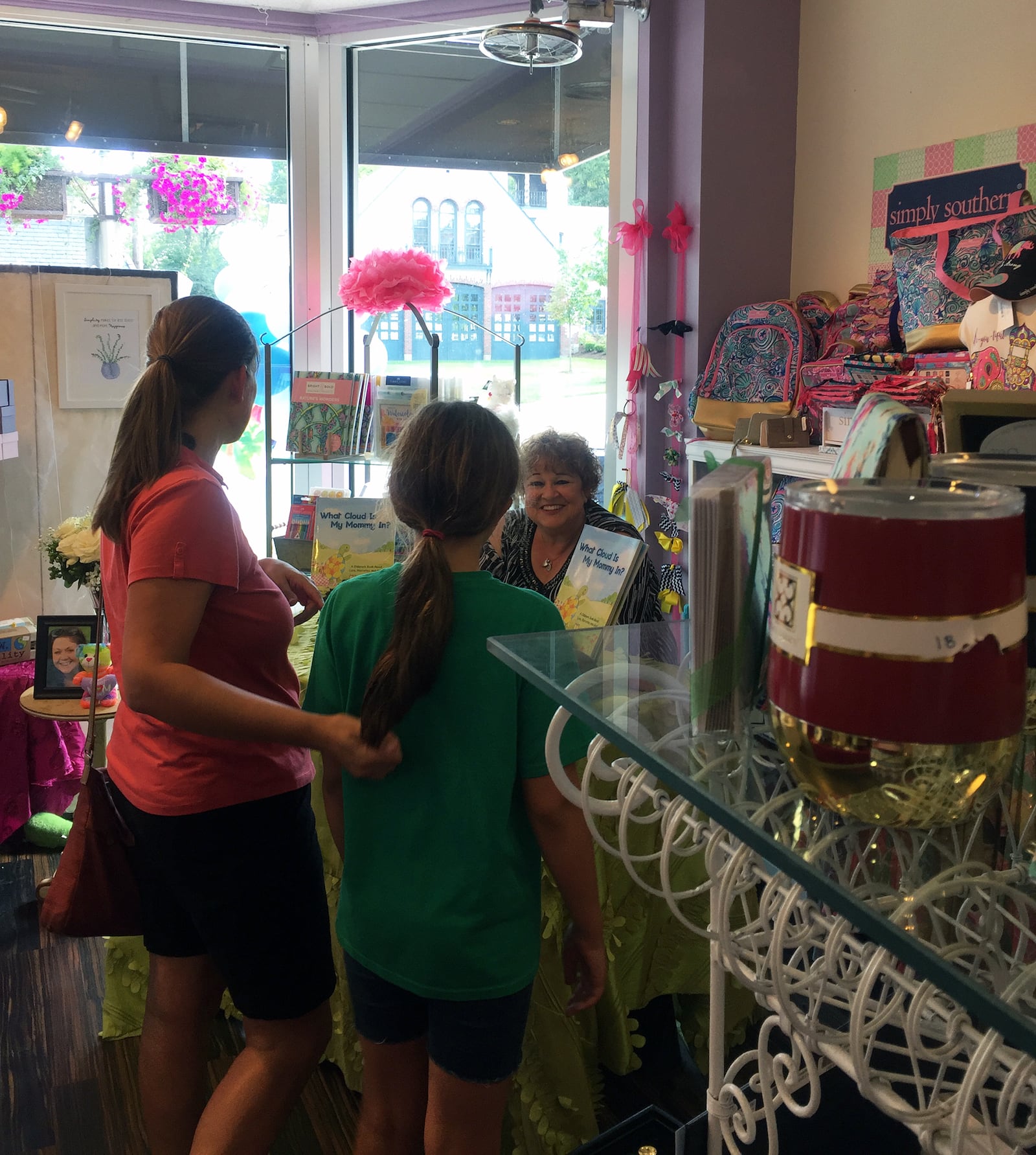 Vesey partnered with illustrator Amy Gantt, who owns LulaBell Art and Design in Oakwood. Vesey is shown at a book signing at the shop. CONTRIBUTED