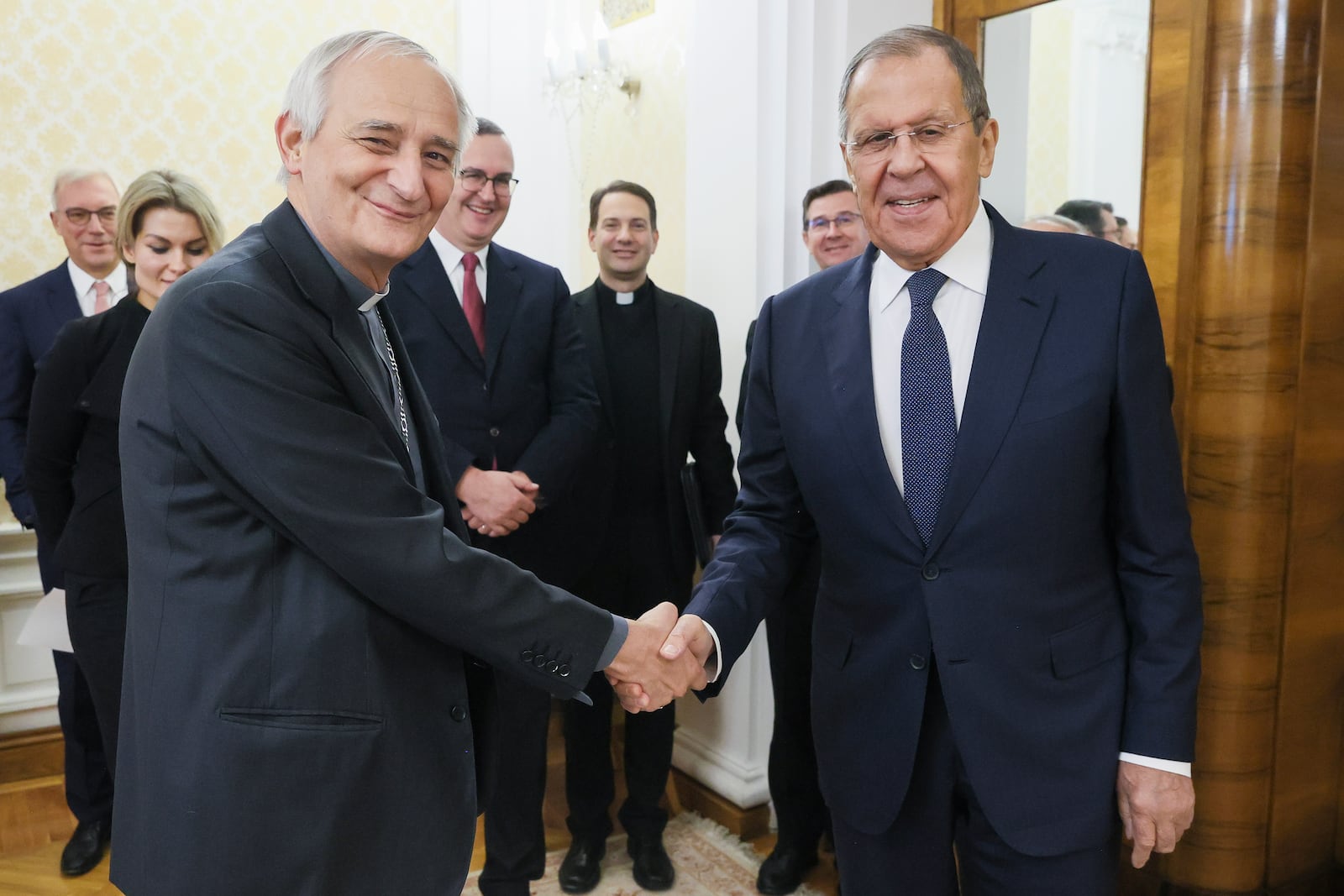 In this photo released by Russian Foreign Ministry press service on Monday, Oct. 14, 2024, Russian Foreign Minister Sergey Lavrov, right, and the President of the Italian Conference of Bishops, Pope Francis' special envoy to pursue peace in Ukraine Cardinal Matteo Zuppi, left, shake hands during their meeting in Moscow, Russia. (Russian Foreign Ministry Press Service via AP)