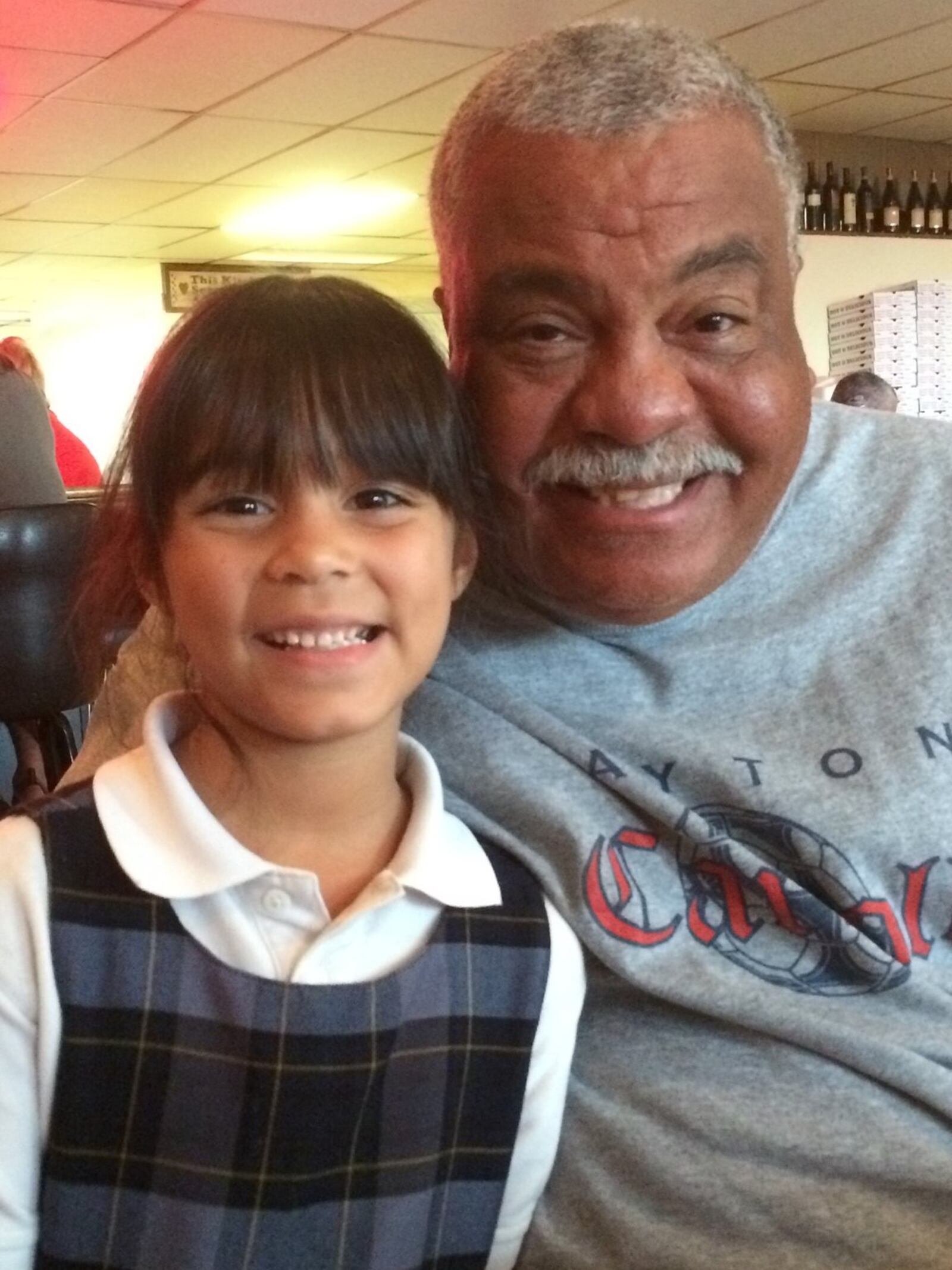 Daryl Jones with his girlfriend’s granddaughter Abela Neu, a second grader at Holy Angels. CONTRIBUTED