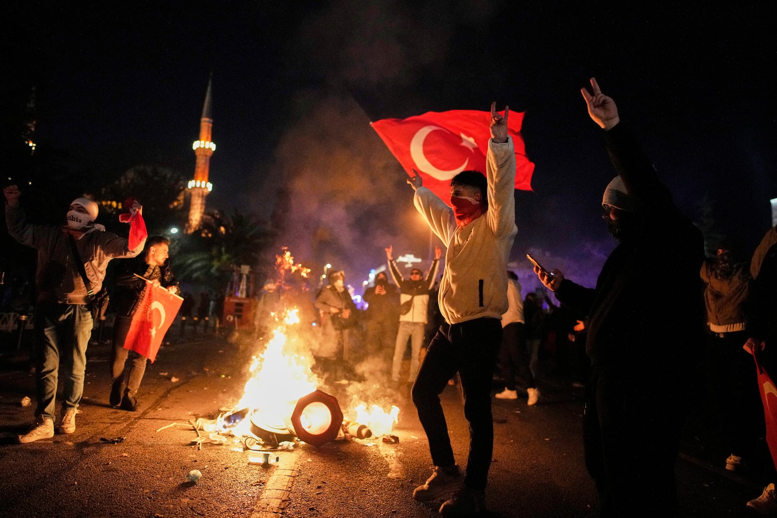 Protesters shout slogans during clashes with anti riot police during a protest against the arrest of Istanbul's Mayor Ekrem Imamoglu in Istanbul, Turkey, Friday, March 21, 2025. (AP Photo/Emrah Gurel)