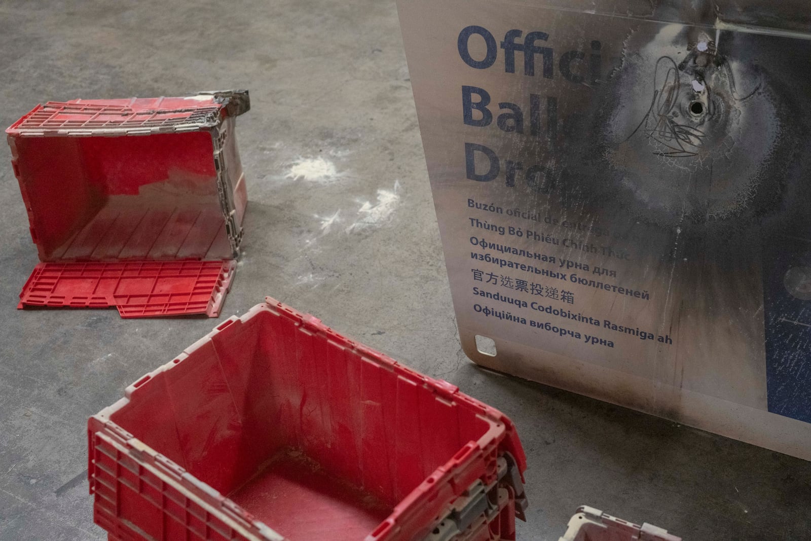 A damaged ballot drop box is displayed during a news conference at the Multnomah County Elections Division office on Monday, Oct. 28, 2024, in Portland, Ore. (AP Photo/Jenny Kane)