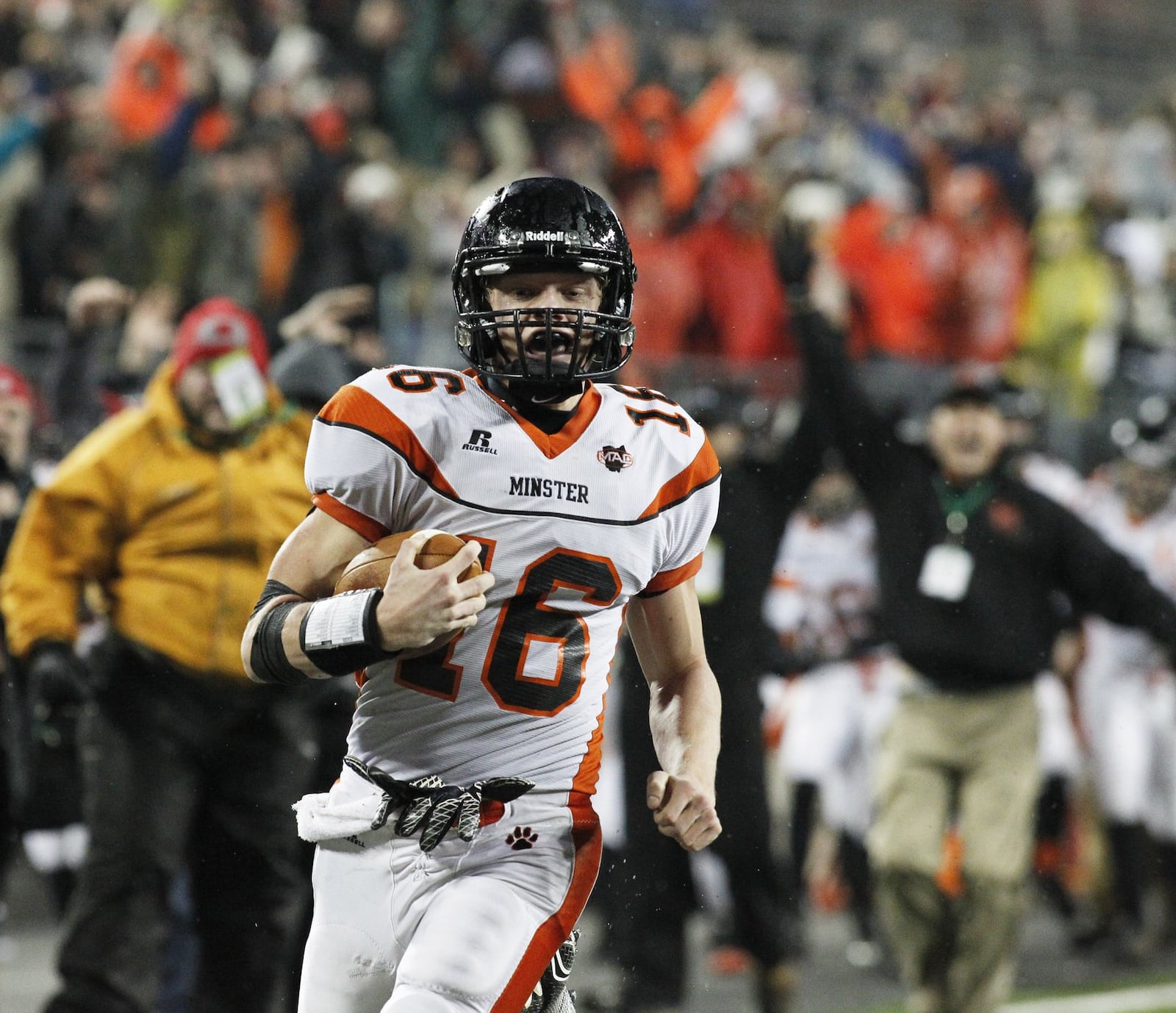 Minster’s Eli Wolf runs for the game-winning touchdown after a reception in the fourth quarter against Kirtland in the Division VI state final on Friday, Dec. 5, 2014, at Ohio Stadium in Columbus. David Jablonski/Staff