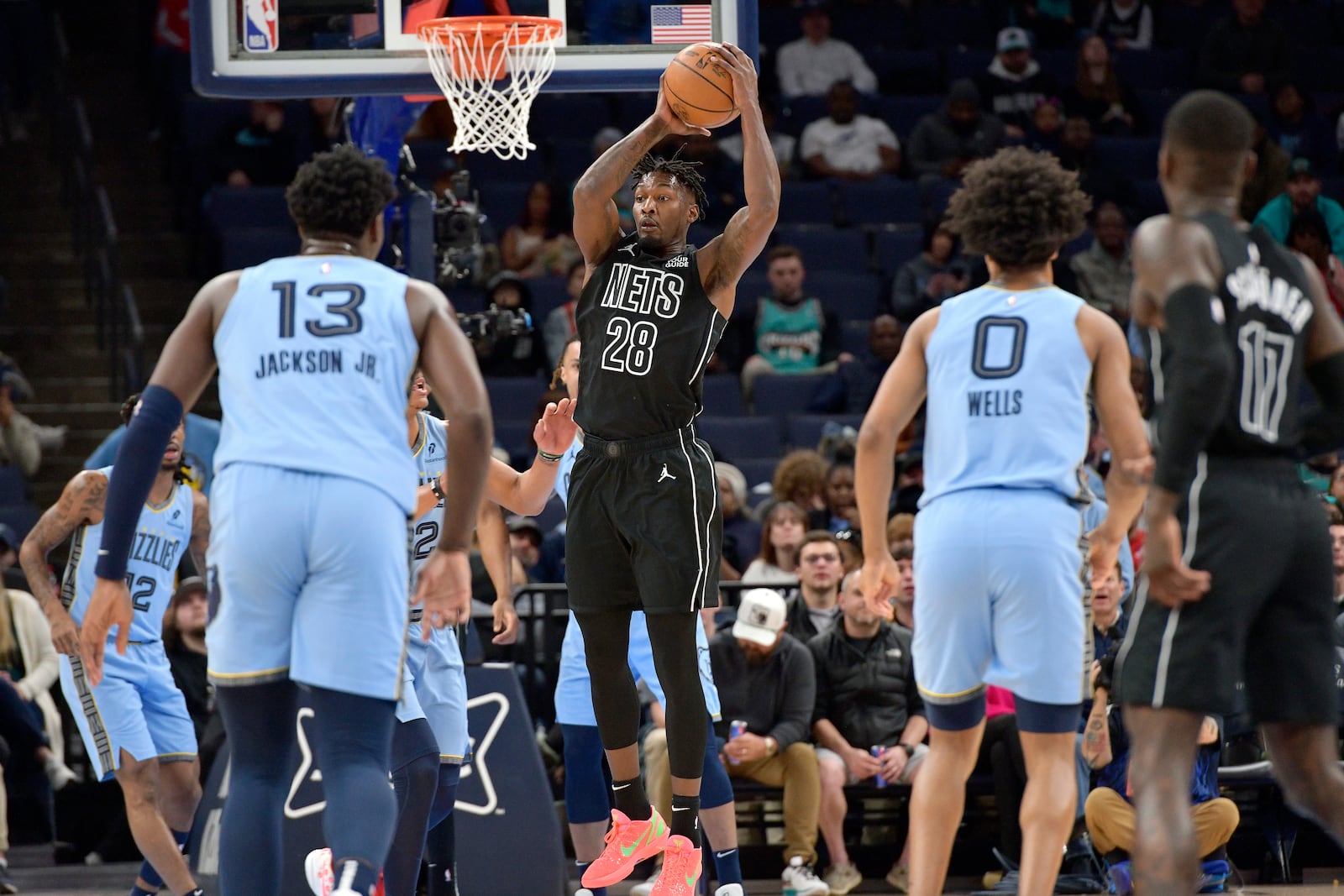 Brooklyn Nets forward Dorian Finney-Smith (28) handles the ball in the first half of an NBA basketball game against the Memphis Grizzlies Friday, Dec. 13, 2024, in Memphis, Tenn. (AP Photo/Brandon Dill)