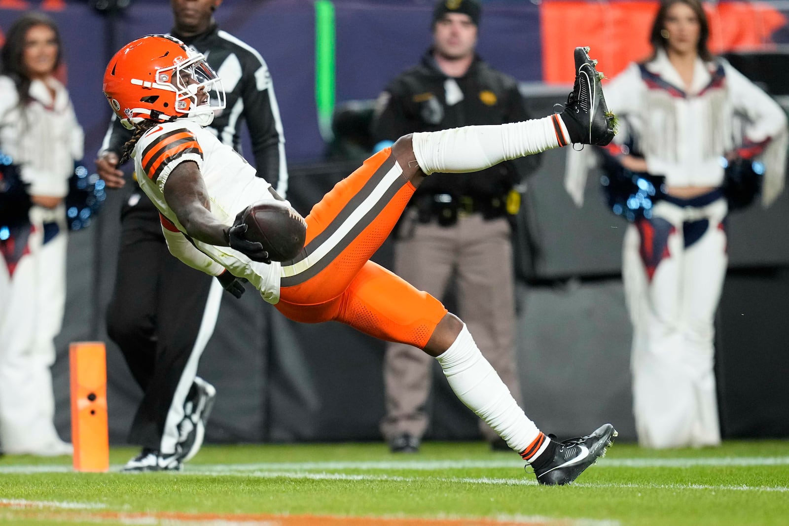 Cleveland Browns wide receiver Jerry Jeudy falls backwards into the endzone after a 70-yard pass reception to score during the second half of an NFL football game against the Denver Broncos, Monday, Dec. 2, 2024, in Denver. (AP Photo/Jack Dempsey)