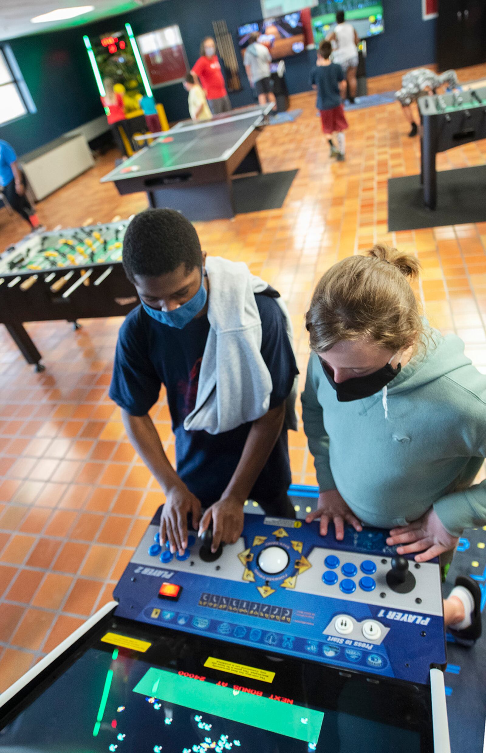 Matthew Williams (left), 17, and Brennen Rice, 11, compete in a video game June 10 at the Prairies Youth Center’s new game room on Wright-Patterson Air Force Base. U.S. AIR FORCE PHOTO/R.J. ORIEZ