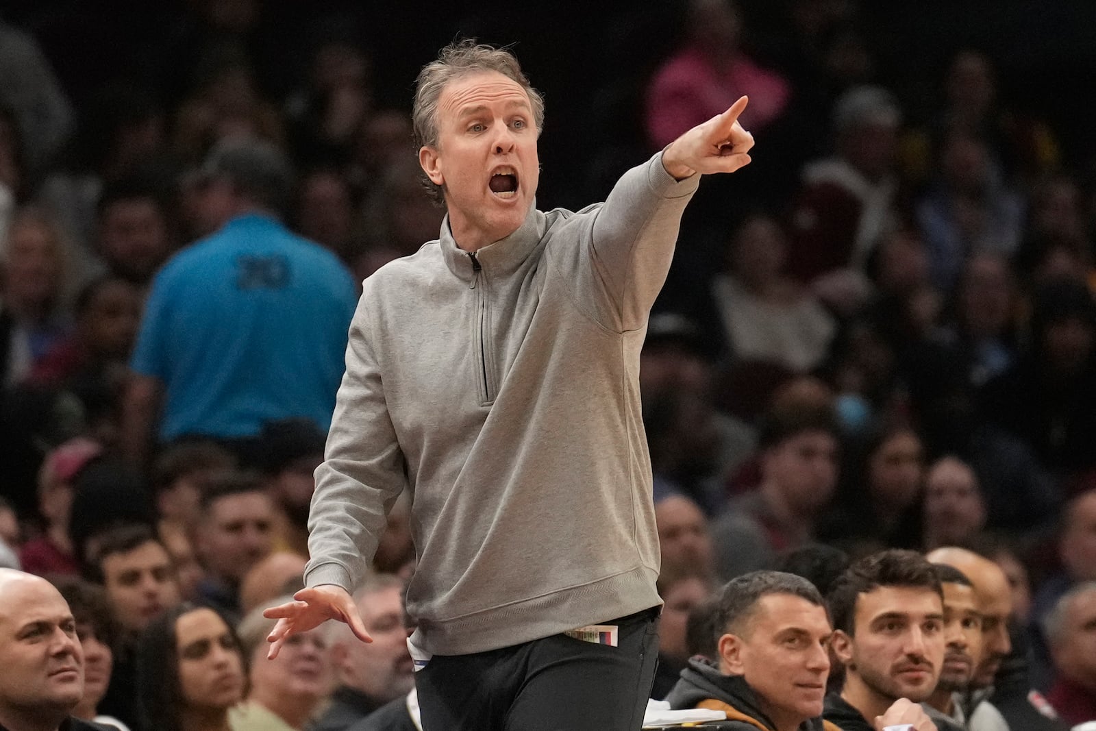 Washington Wizards head coach Brian Keefe gestures in the first half of an NBA basketball game against the Cleveland Cavaliers Friday, Dec. 13, 2024, in Cleveland. (AP Photo/Sue Ogrocki)