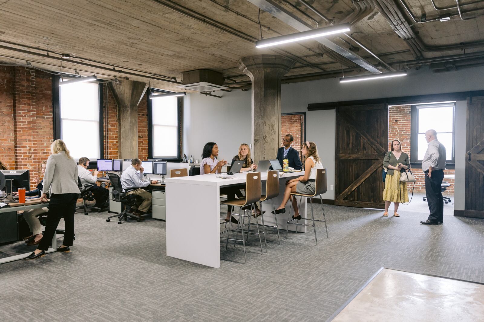 Employees at work in the Dayton Daily News newsroom at 601 E. Third St., Ste. 600, Dayton, Ohio