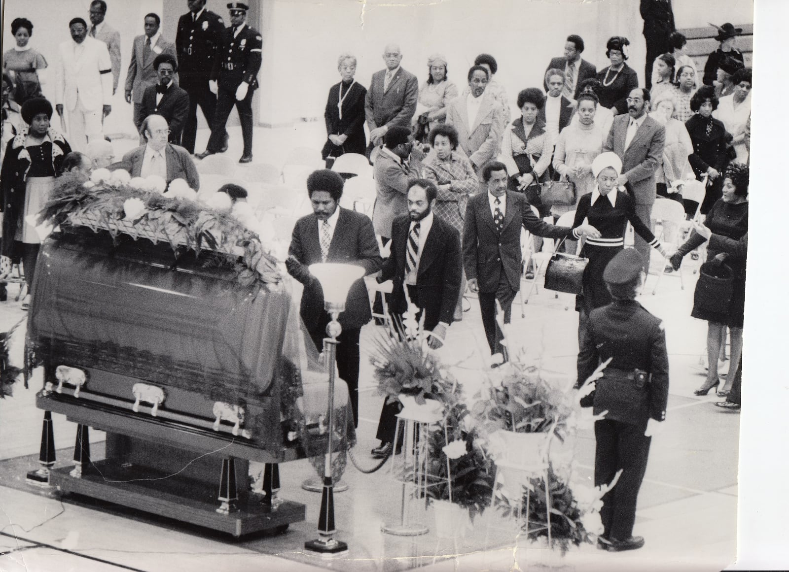  J. W. Mcintosh, the son of W.S. McIntosh, stands at his father's casket during his funeral March 8, 1974. DAYTON DAILY NEWS / WRIGHT STATE UNIVERSITY SPECIAL COLLECTIONS AND ARCHIVE