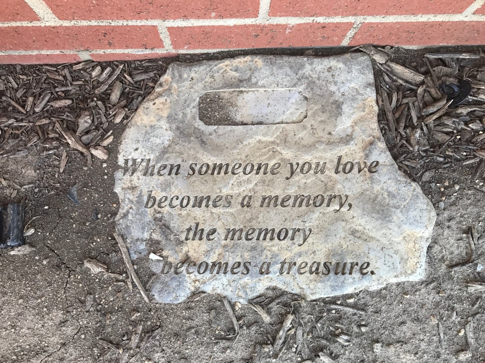 A memorial stone honors former Twin Valley South football player Joe Kasserman just outside the team dressing room at field that the players still touch before taking the field. Tom Archdeacon/STAFF