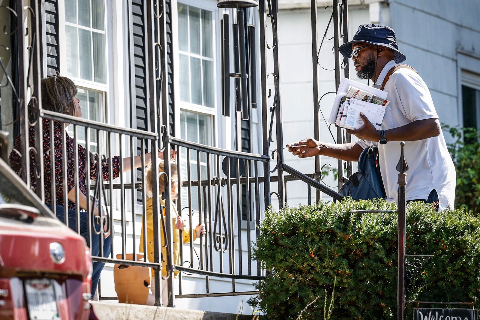 A mail carrier delivers mail to a Dayton eastside resident Wednesday October 5, 2022. JIM NOELKER/STAFF