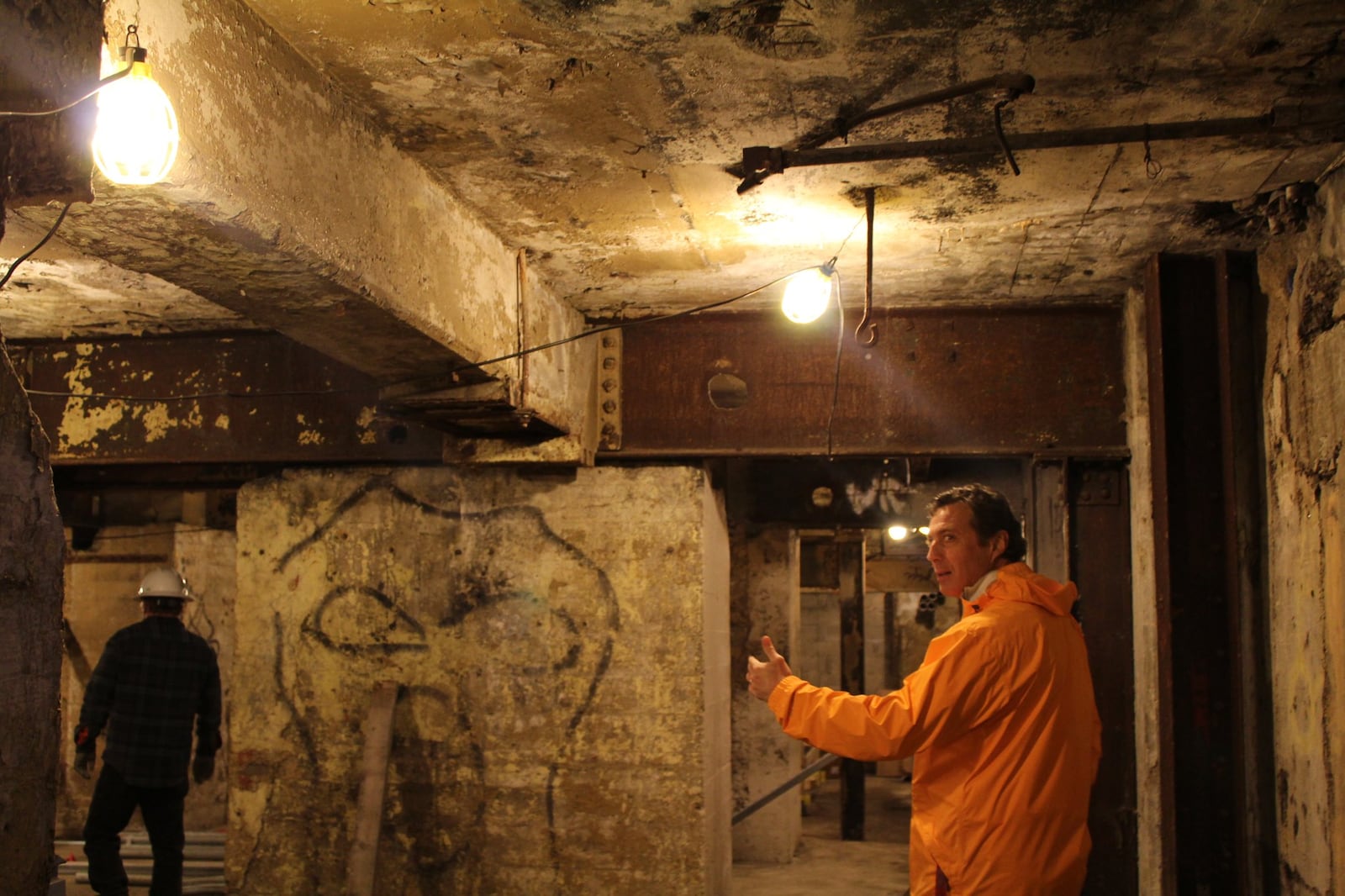 John Riazzi walks through the basement of the former Dayton Power & Light steam plant. The basement will be converted into exercise space and area for catering preparations. CORNELIUS FROLIK / STAFF