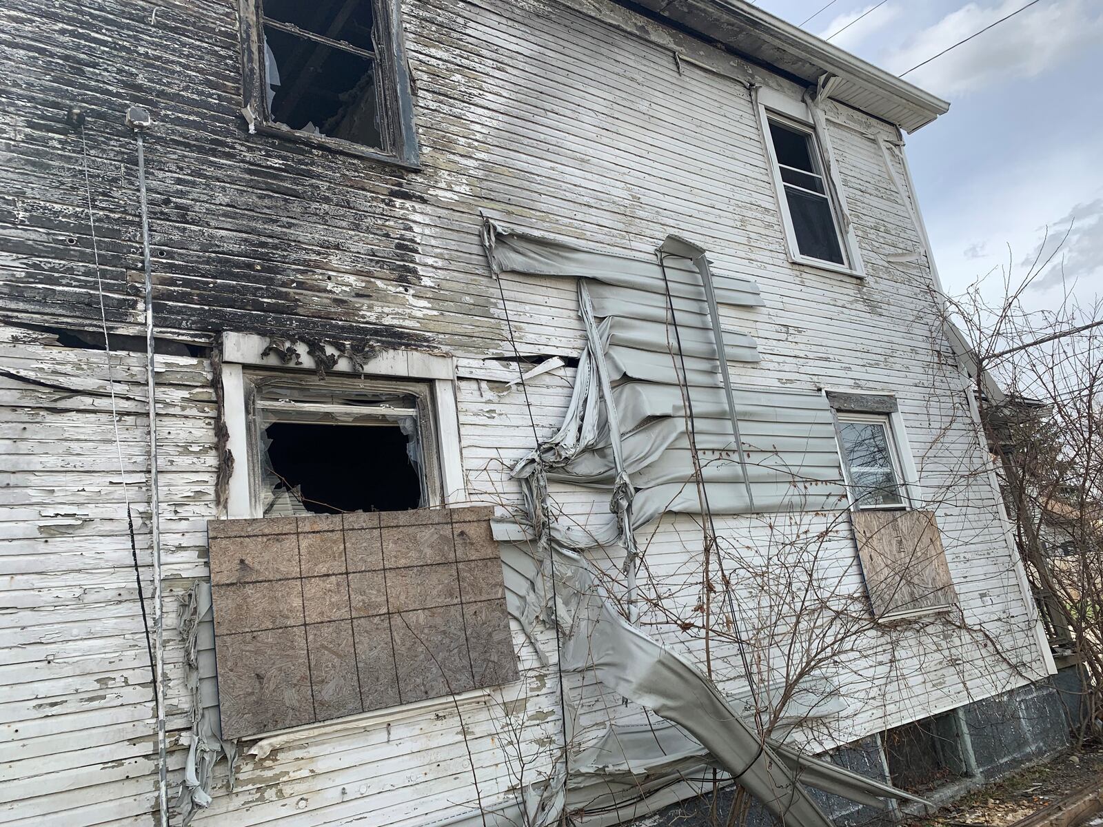 This owners of this duplex on Xenia Avenue in Dayton received $19,125 in rental assistance last year through a rental assistance program funded by federal CARES Act dollars. They claimed renters lived there, though neither unit had water service last year, and signs on the property say presence there is prohibited and the property is a risk to firefighters.