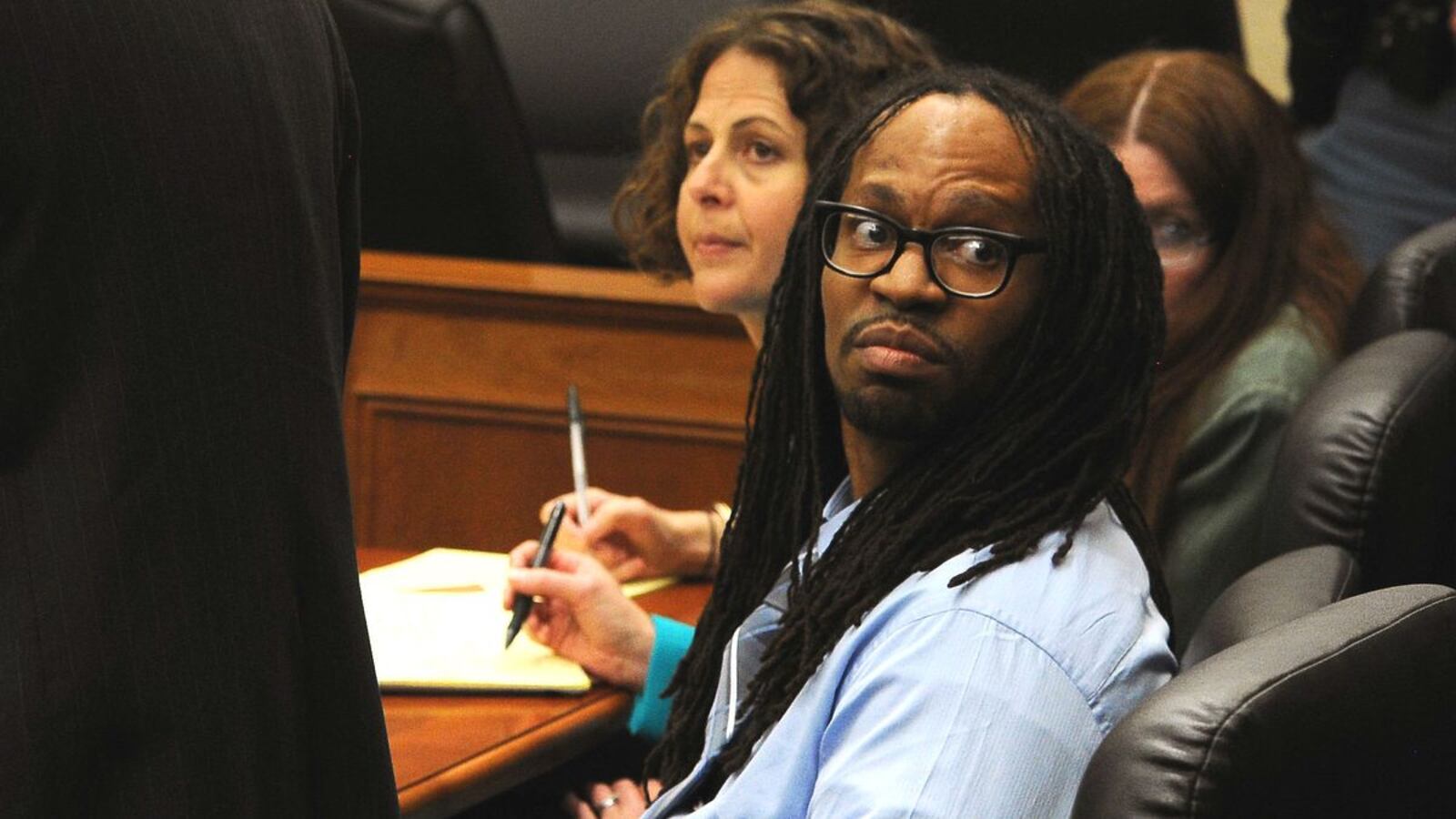 Convicted killer Nathan Dunlap, who murdered four people in an Aurora, Colo, Chuck E. Cheese in 1993, listens to 2013 court proceedings in his case. Dunlap, who was on Colorado's death row, had his sentence commuted Monday, March 23, 2020, when Colorado's death penalty was abolished.