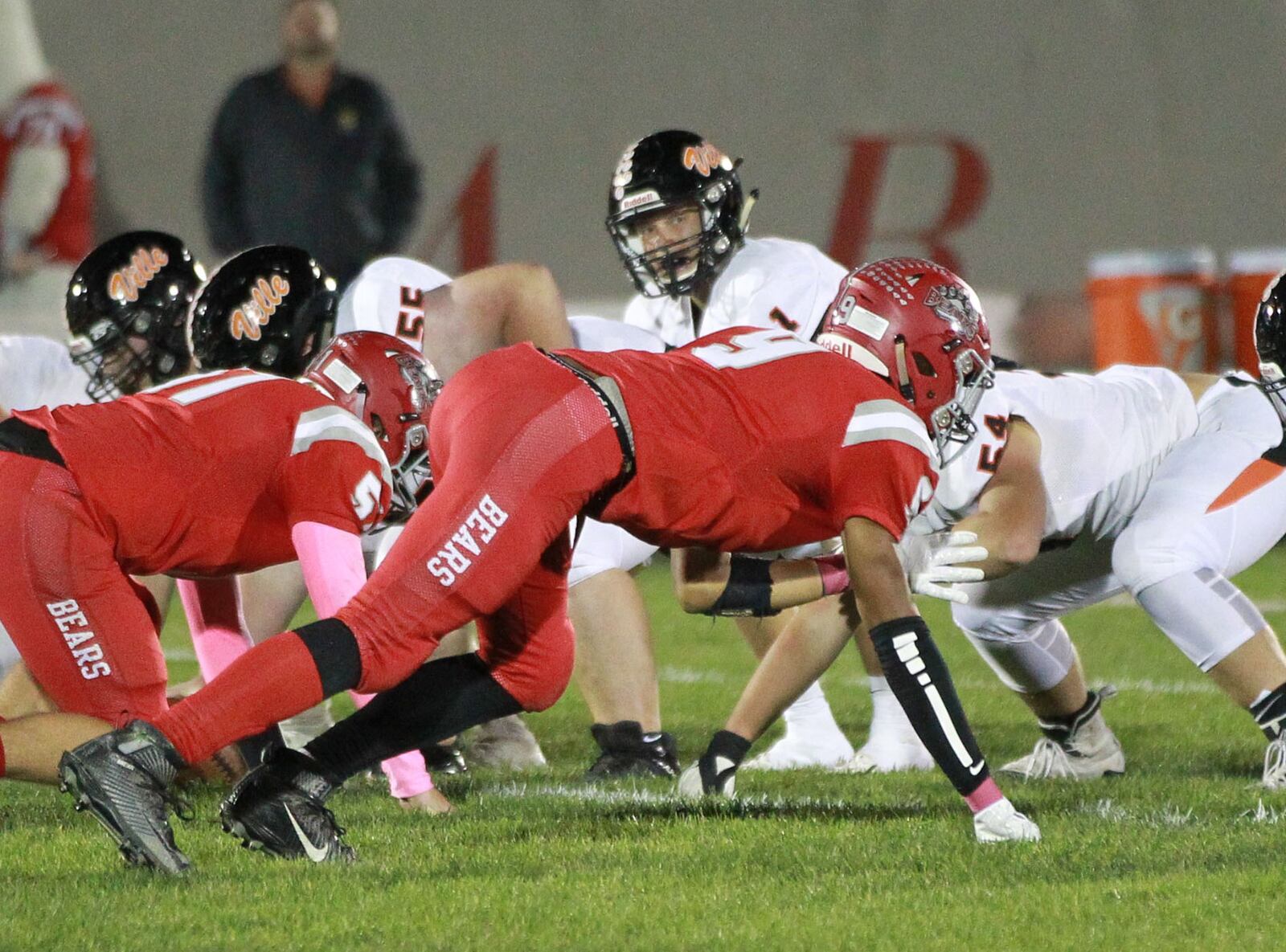 Phillip Garrison of Northridge (near) draws the attention of Northridge QB Jake Amburgy. Waynesville defeated host Northridge 23-8 in a Week 9 high school football game on Thursday, Oct. 24, 2019. MARC PENDLETON / STAFF