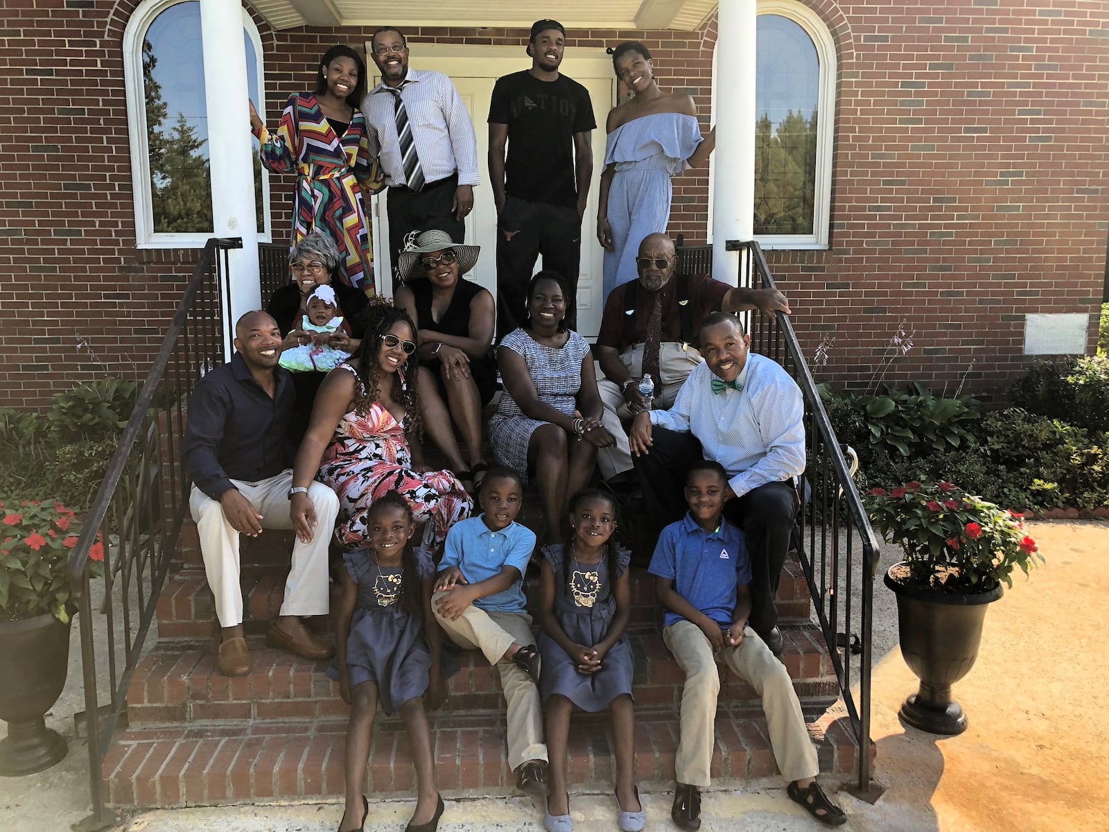 The Martin Family: Lefty (sitting on top step on right) and Brenda (top step on left). CONTRIBUTED