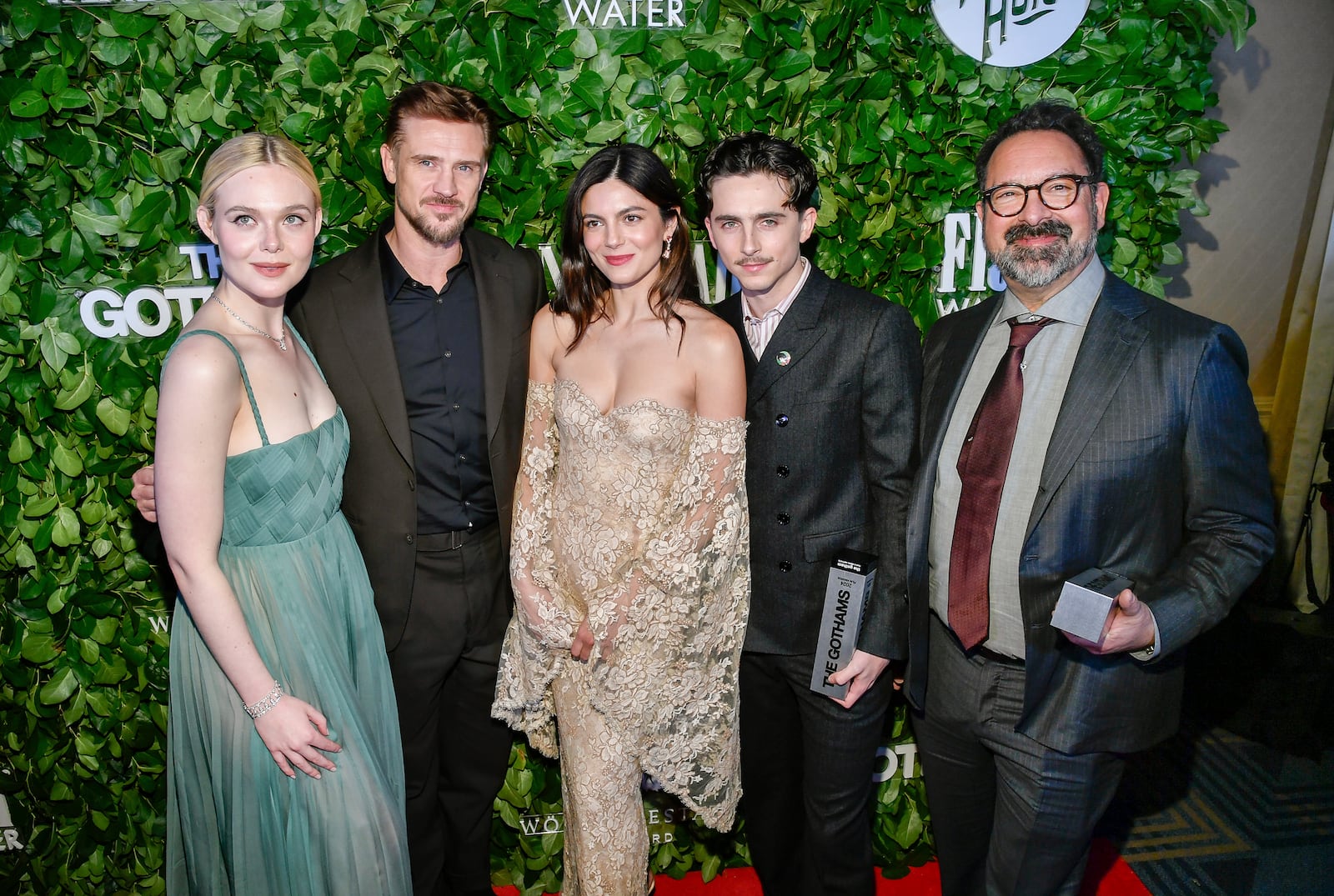 Elle Fanning, from left, Boyd Holbrook and Monica Barbaro pose with honorees Timothee Chalamet and James Mangold with their visionary tribute awards for "A Complete Unknown" during The Gothams Film Awards at Cipriani Wall Street on Monday, Dec. 2, 2024, in New York. (Photo by Evan Agostini/Invision/AP)