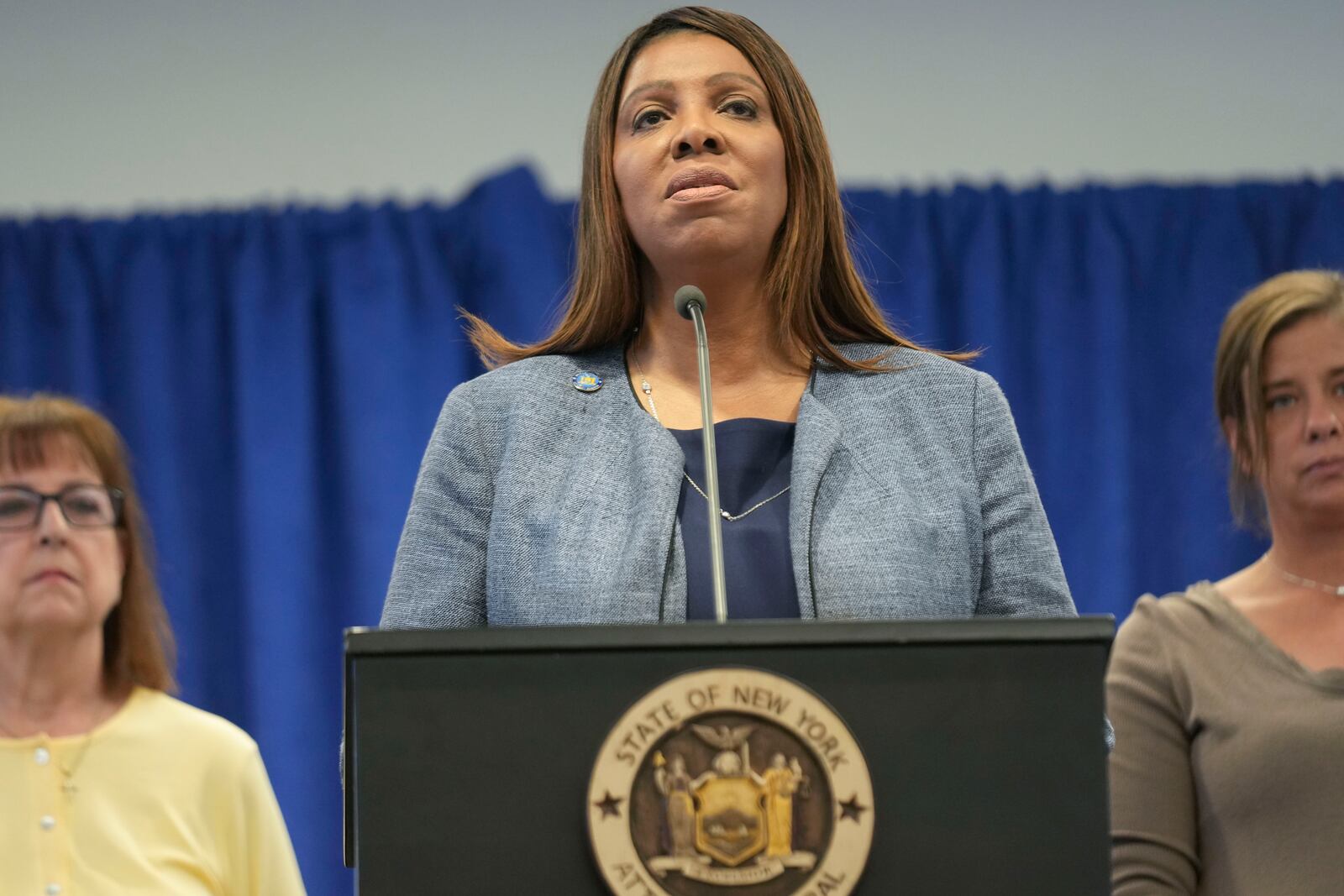 Surrounded by people involved with the fight against the opioid epidemic, New York Attorney General Letitia James, center, speaks about a settlement with regard to the opioid crisis at a news conference in New York, Thursday, Jan. 23, 2025. (AP Photo/Seth Wenig)