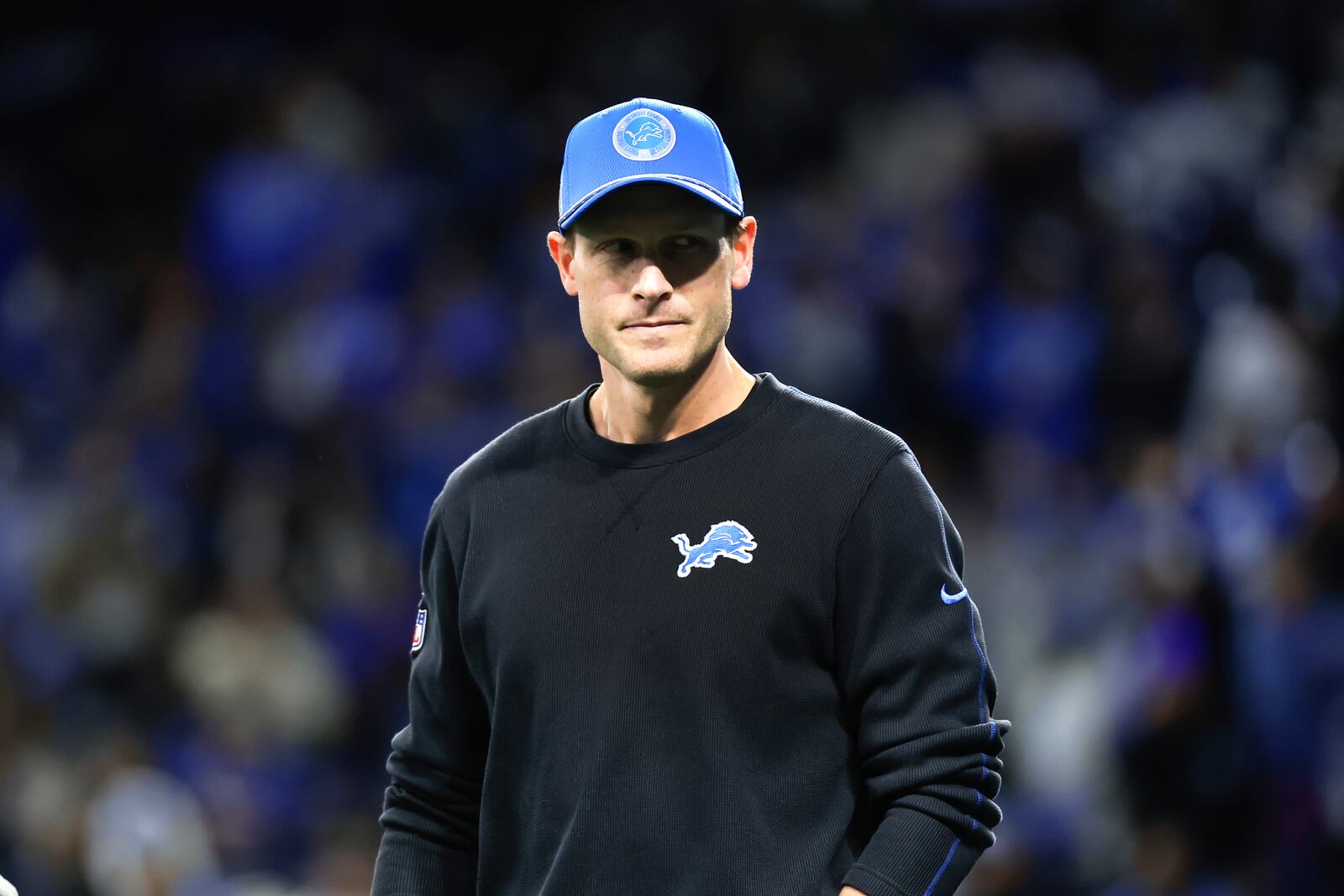 Detroit Lions offensive coordinator Ben Johnson watches during warmups before an NFL football divisional playoff game against the Washington Commanders, Saturday, Jan. 18, 2025, in Detroit. (AP Photo/Rey Del Rio)