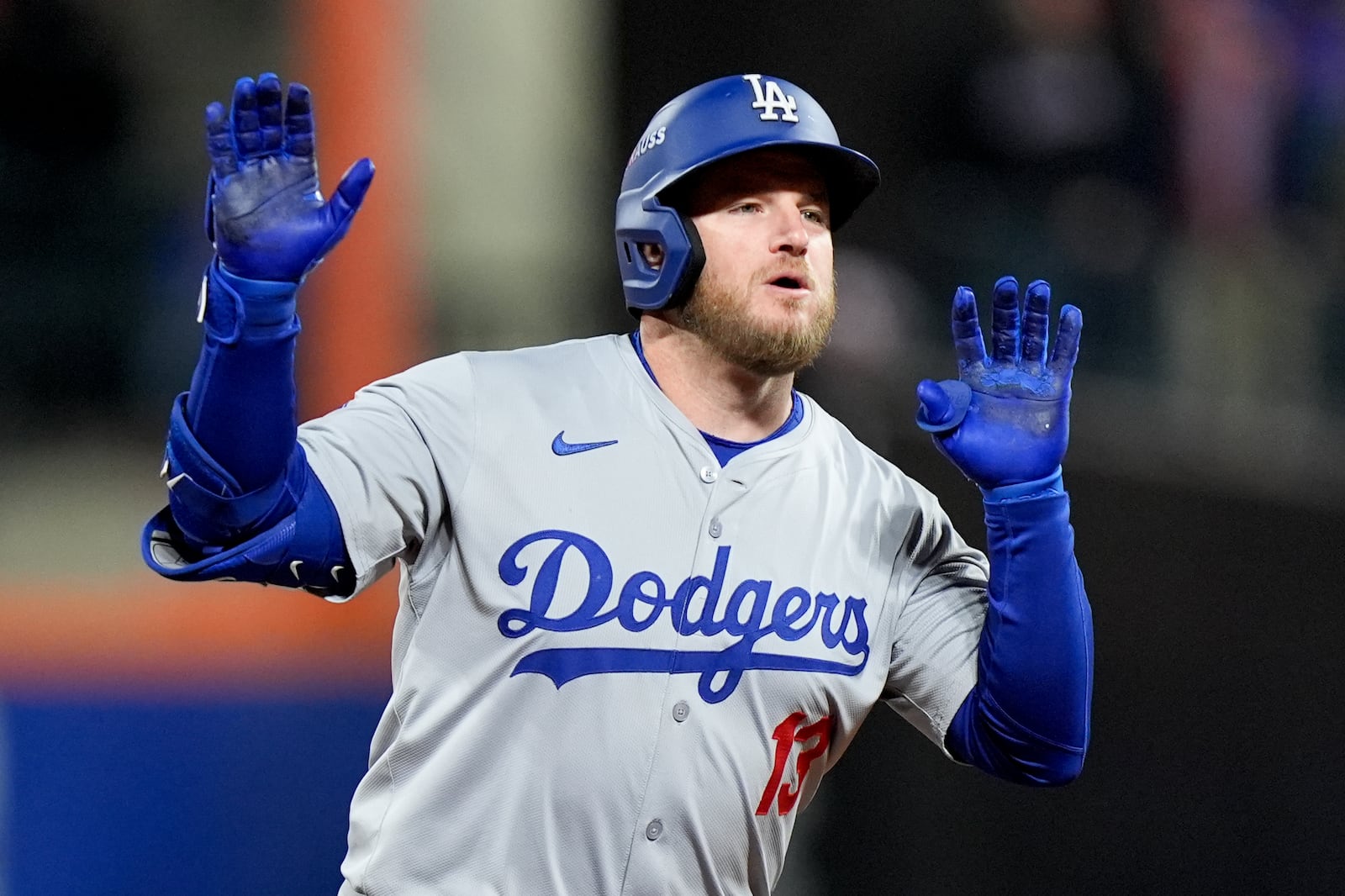 Los Angeles Dodgers' Max Muncy celebrates a home run against the New York Mets during the ninth inning in Game 3 of a baseball NL Championship Series, Wednesday, Oct. 16, 2024, in New York. (AP Photo/Frank Franklin II)