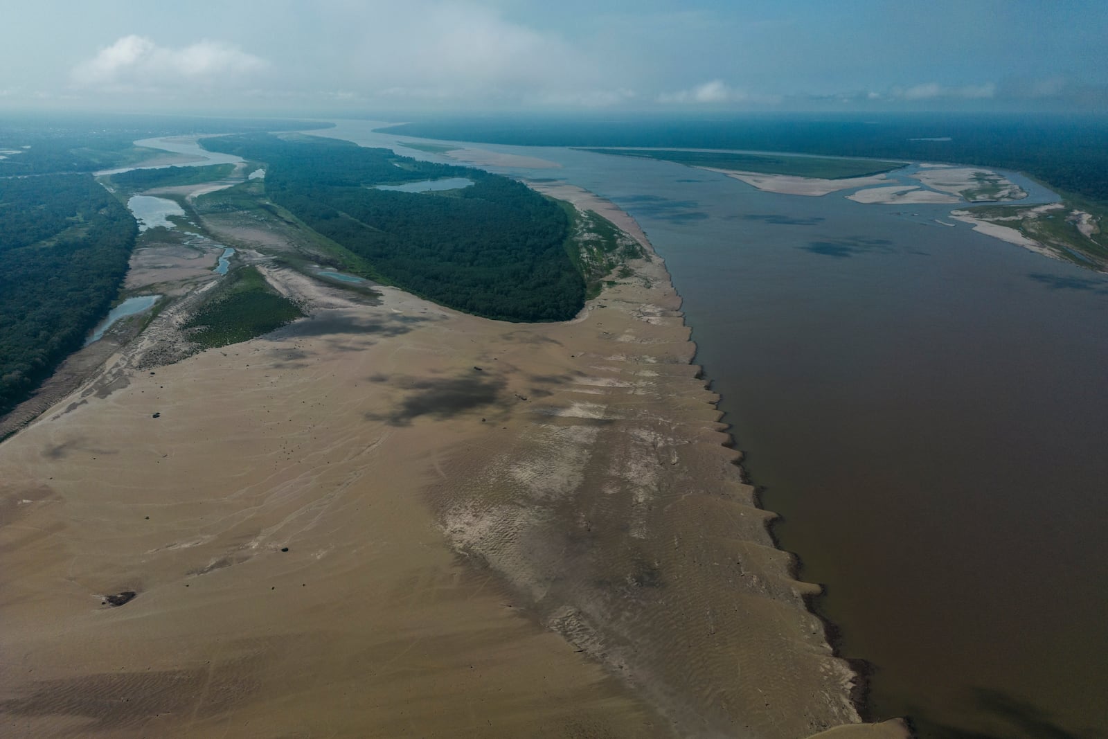 Signs of drought are visible on the Amazon River, near Leticia, Colombia, Sunday, Oct. 20, 2024. (AP Photo/Ivan Valencia)