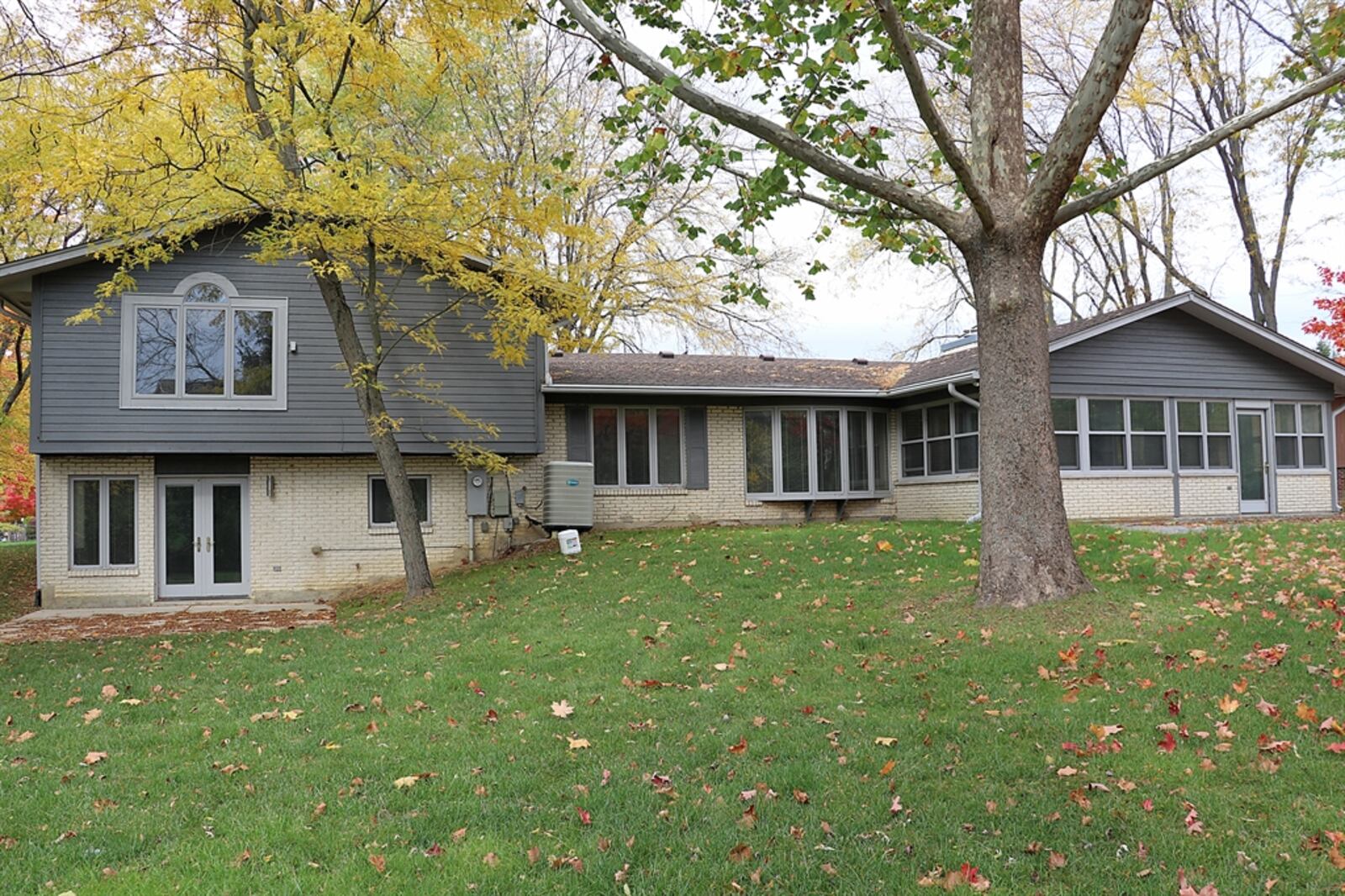 Located within the Oak Creek subdivision of Washington Twp., the property sits off the road with a canopy of mature trees along the open backyard.