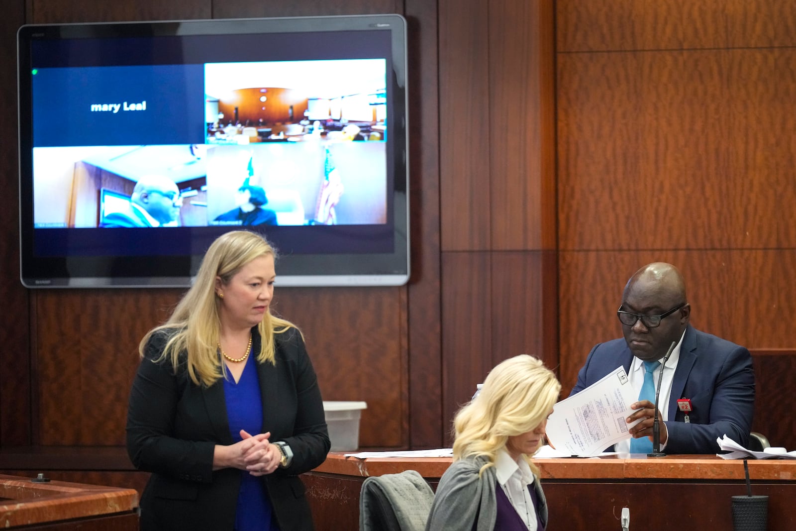 Prosecutor Celeste Byron, left, questions Dr. Kwabena Sarpong, of Texas Children's Hospital, during the punishment phase in Gloria Williams' trial, Tuesday, Nov. 12, 2024, at the Harris County Criminal Justice Center in Houston. (Brett Coomer/Houston Chronicle via AP)