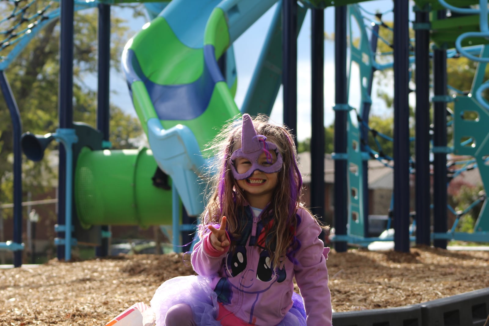 Maya Queen, 5, enjoys new playground equipment at Ridgecrest Park. CORNELIUS FROLIK / STAFF