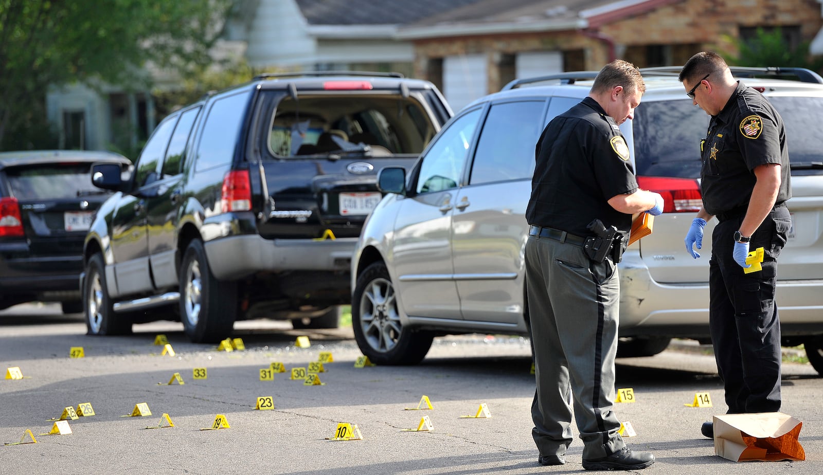 Members of the Montgomery County Sheriff's Office investigate a shooting Friday, July 17, 2020, on Fer Don Road in Harrison Twp. MARSHALL GORBY\STAFF