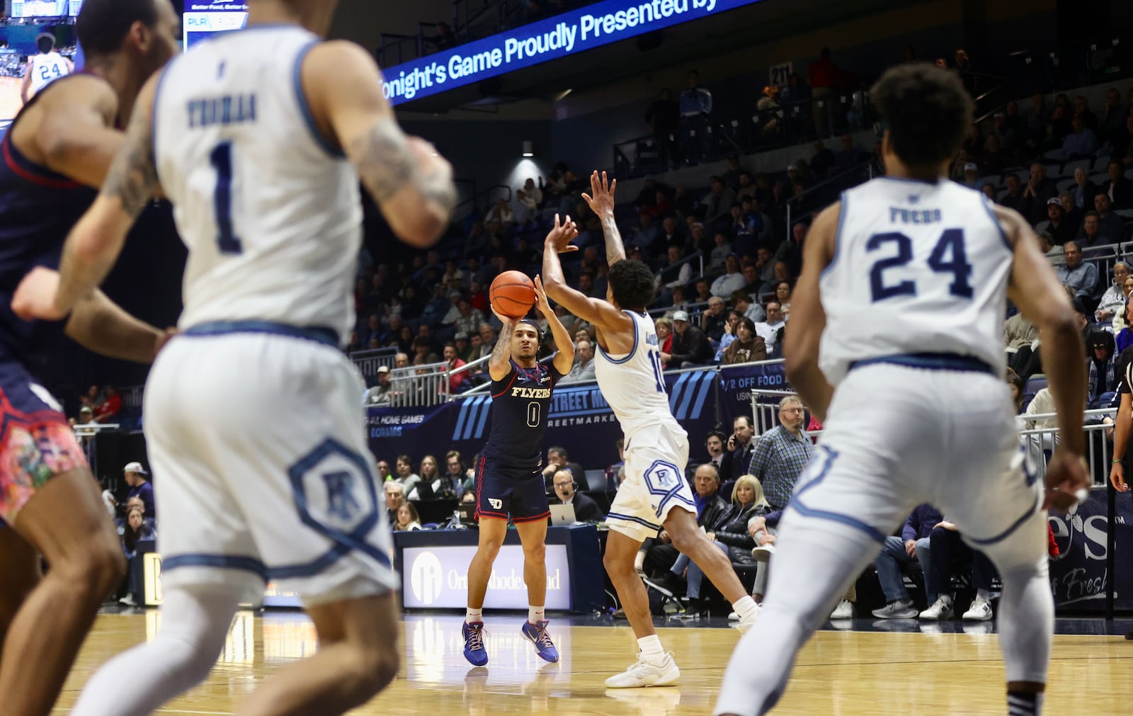 Dayton's Javon Bennett makes a 3-pointer in the second half against Rhode Island on Wednesday, Feb. 26, 2025, at the Ryan Center in Kingston, R.I. David Jablonski/Staff