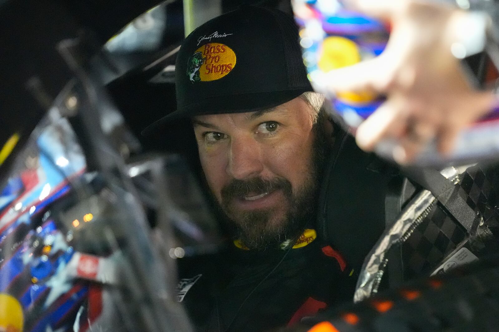 Martin Truex Jr., in his car, prepares for the start of the first of two NASCAR Daytona 500 qualifying auto races at Daytona International Speedway, Thursday, Feb. 13, 2025, in Daytona Beach, Fla. (AP Photo/John Raoux)