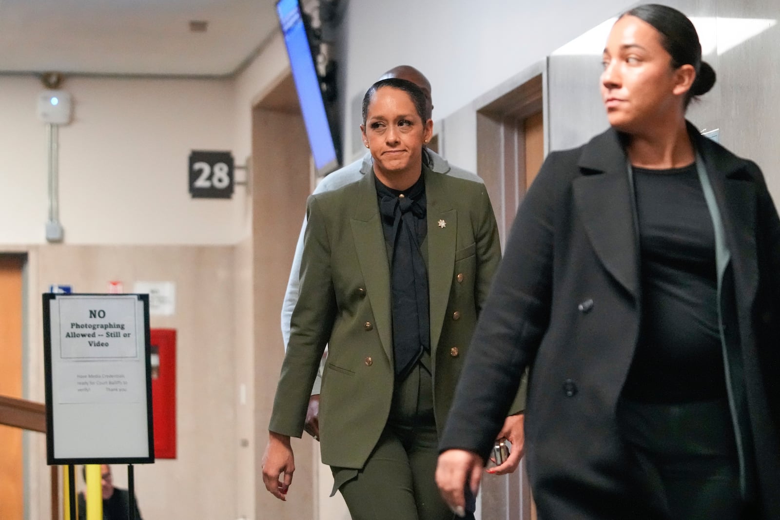 San Francisco district attorney Brooke Jenkins, center, walks out of the courtroom at the Hall of Justice for the murder trial of Nima Momeni, Monday, Dec. 2, 2024, in San Francisco. (AP Photo/Godofredo A. Vásquez)