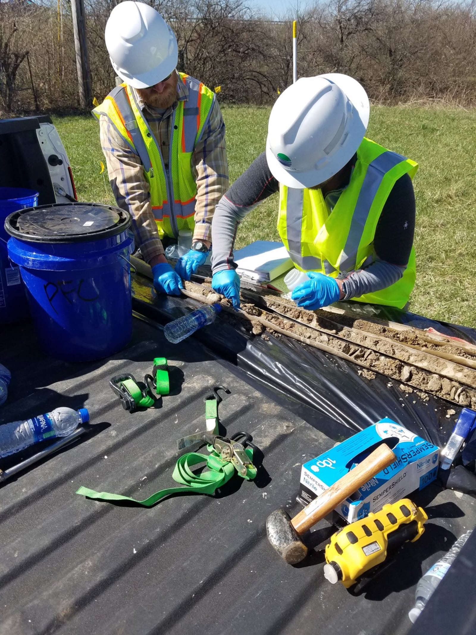 Wright Patterson Force Base crews collect drinking water samples from a field in Fairborn where a jet crashed in 1997. The base sampled 22 wells in nearby neighborhoods for a group of contaminants known as PFAS. Contributed