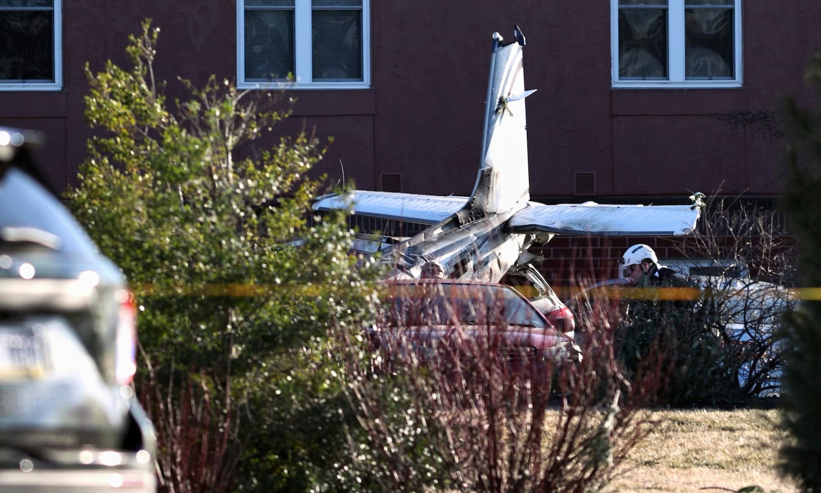 First responders work the scene after a plane crashed in a parking lot of a retirement community Sunday, March 9, 2025, in Manheim Township, Pa. (Zach Gleiter/The Patriot-News via AP)