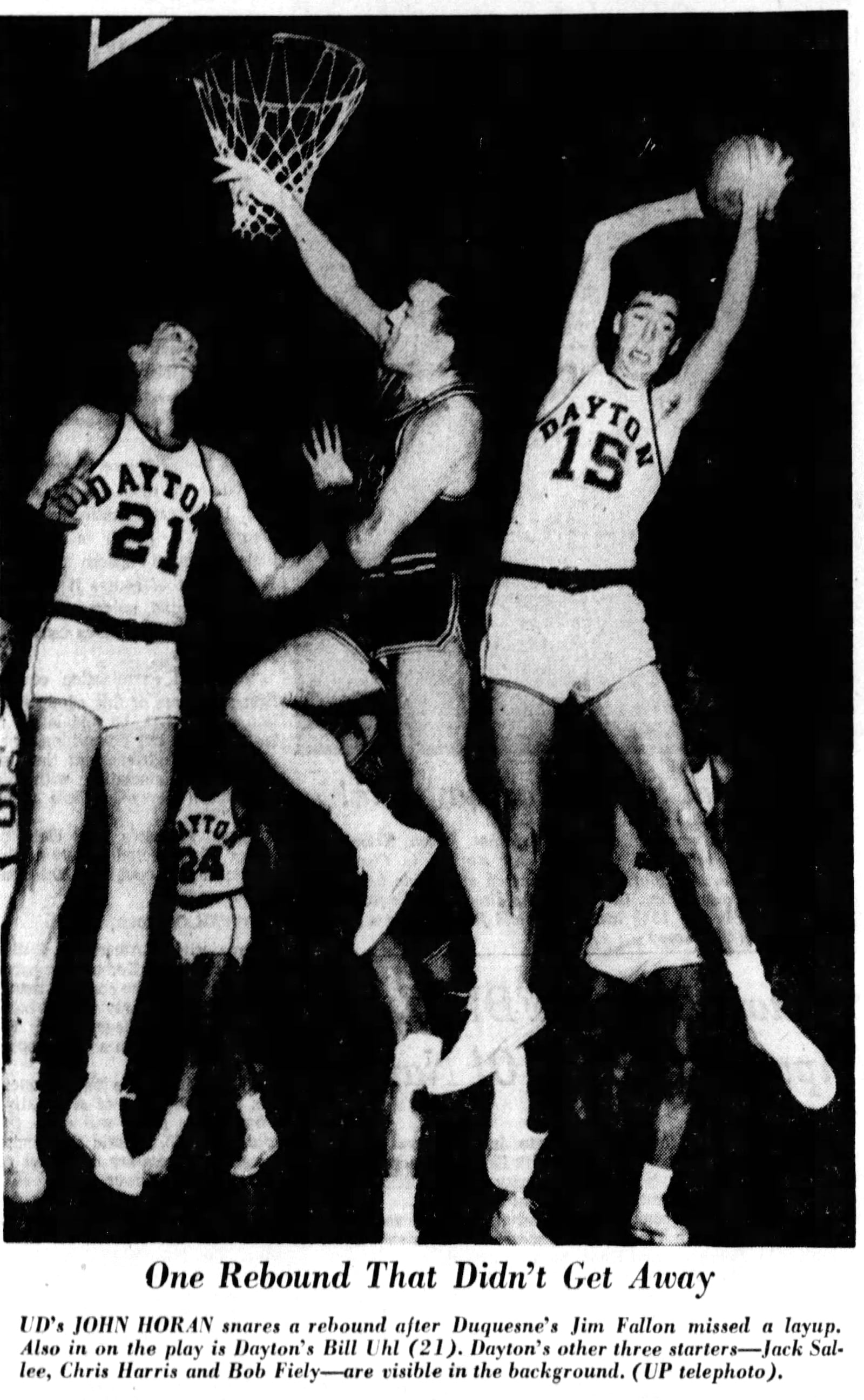 Dayton forward John Horan grabs a rebound during a game against the University of Cincinnati in 1955. DAYTON DAILY NEWS ARCHIVES