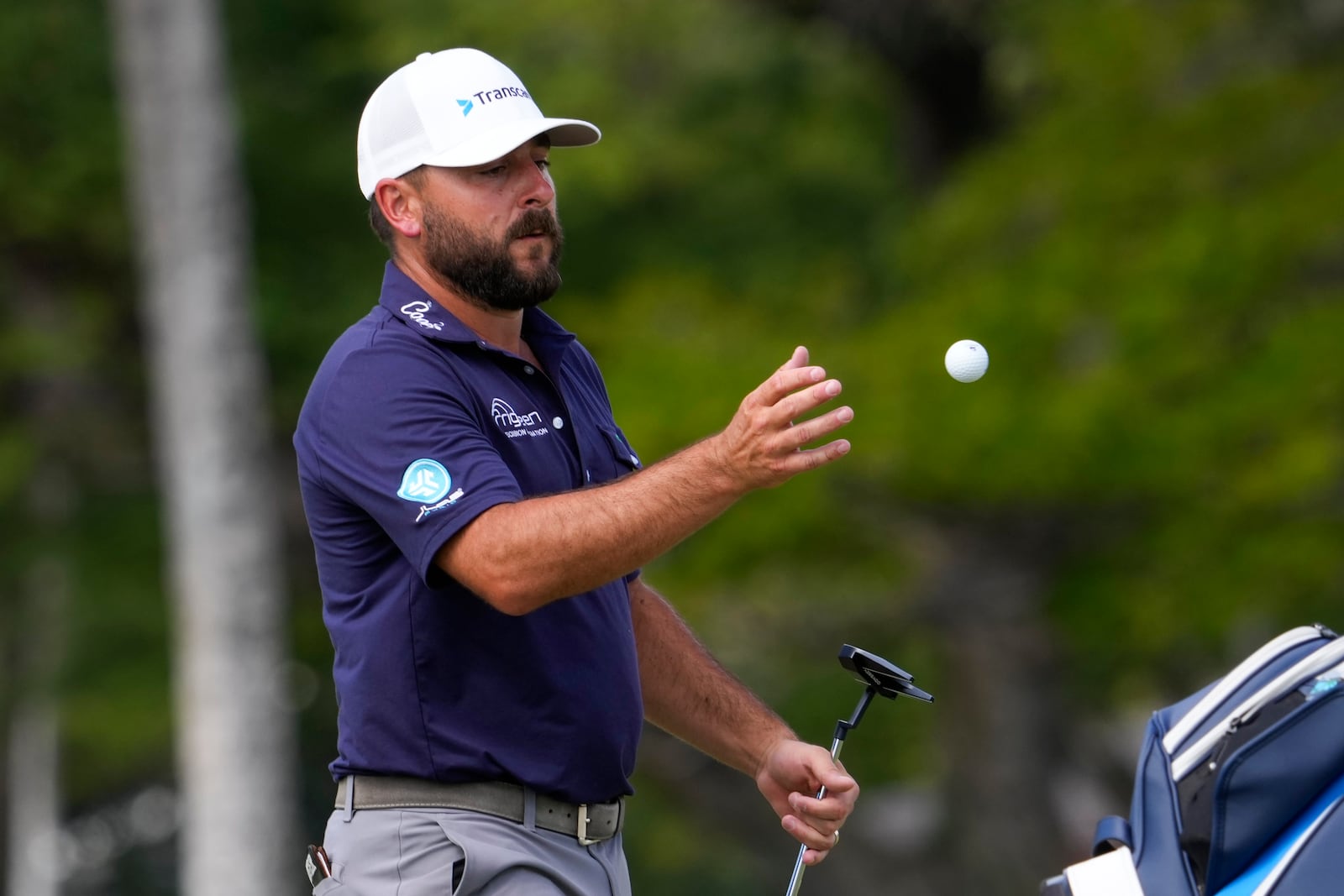 Stephan Jaeger catches a ball from his caddie on the 13th hole during the final round of the Sony Open golf event, Sunday, Jan. 12, 2025, at Waialae Country Club in Honolulu. (AP Photo/Matt York)