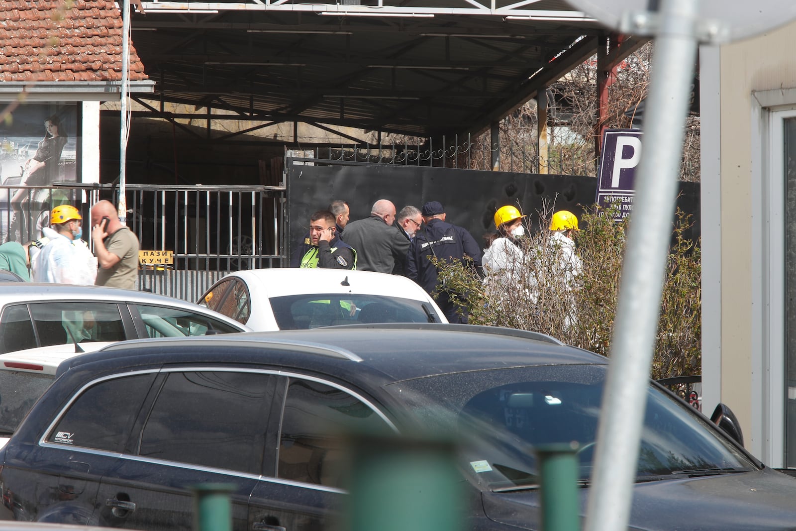 Police officers investigate a nightclub after a massive fire in the town of Kocani, North Macedonia, Sunday, March 16, 2025. (AP Photo/Boris Grdanoski)