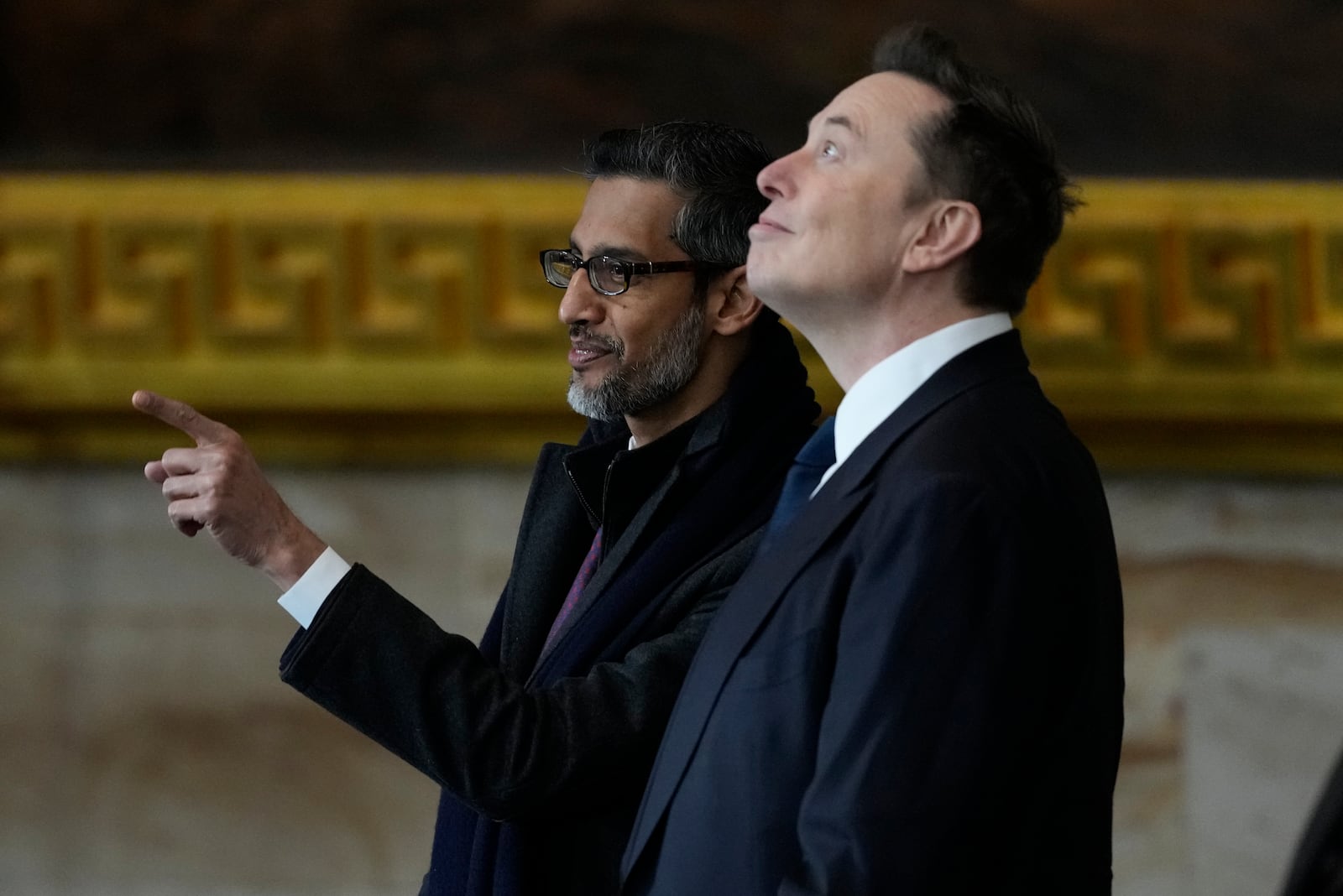 Google CEO Sundar Pichai and Elon Musk arrive before the 60th Presidential Inauguration in the Rotunda of the U.S. Capitol in Washington, Monday, Jan. 20, 2025. (AP Photo/Julia Demaree Nikhinson, Pool)