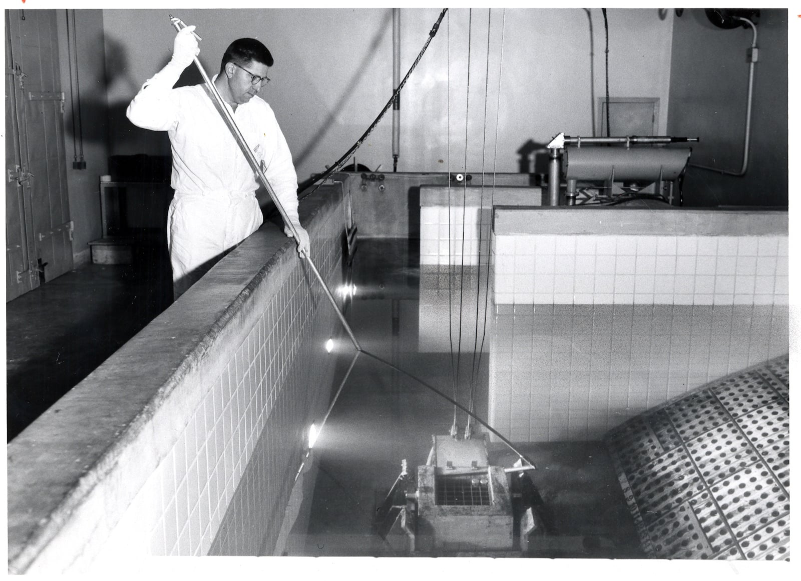 A Mound Laboratory employee works in the polonium processing area of the plant in 1958.