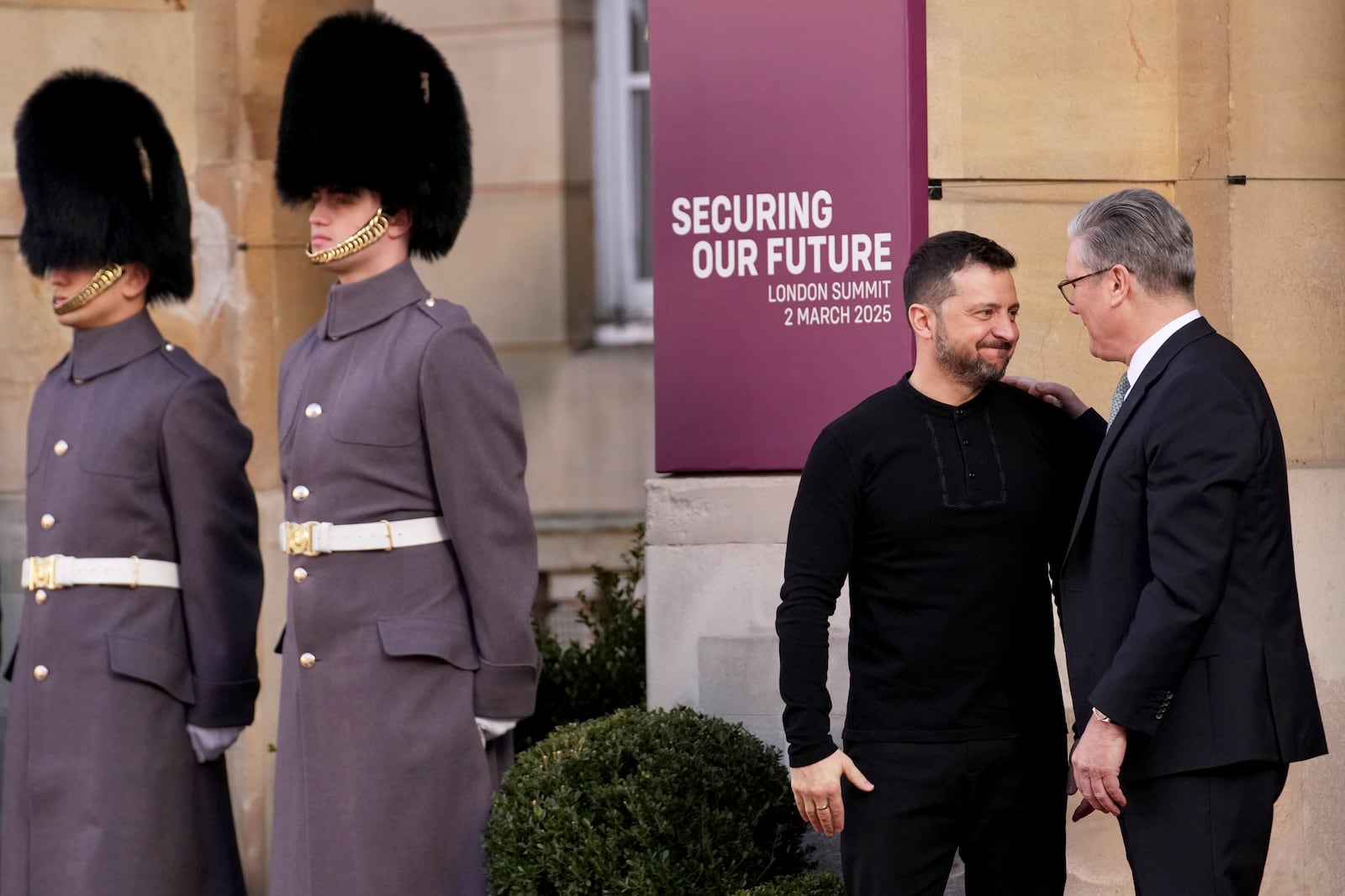 Britain's Prime Minister Keir Starmer, right, speaks with Ukraine's President Volodymyr Zelenskyy as he arrives for a summit on Ukraine at Lancaster House in London, Sunday, March 2, 2025. (AP Photo/Christophe Ena, Pool)