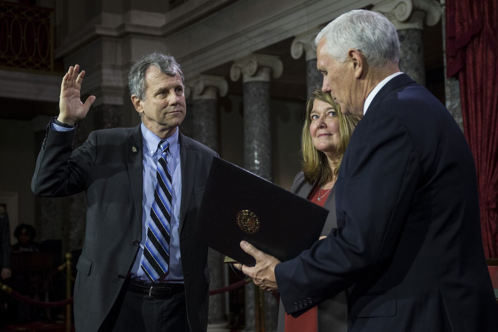 WASHINGTON, DC - JANUARY 03: Sen. Sherrod Brown (D-OH) participates in a mock swearing in ceremony with Vice President Mike Pence on Capitol Hill on January 3, 2019 in Washington, DC. (Photo by Zach Gibson/Getty Images)