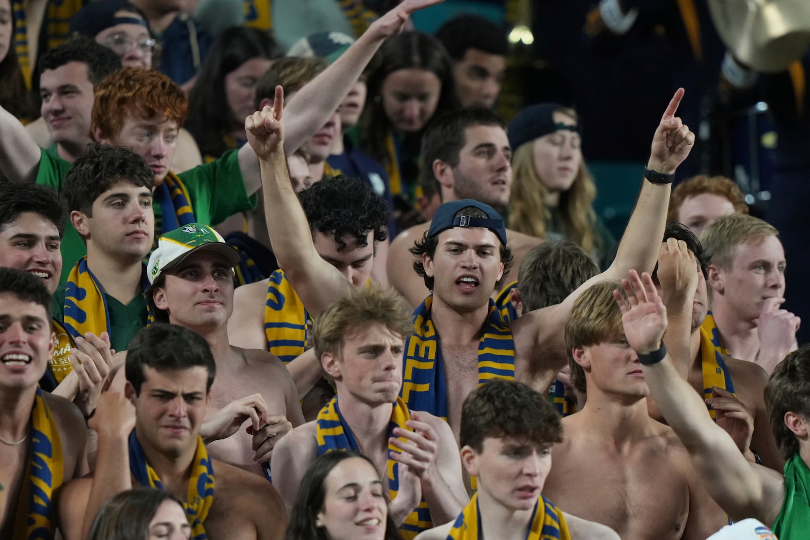 Notre Dame fans celebrate during the second half of the Orange Bowl College Football Playoff semifinal game against Penn State, Thursday, Jan. 9, 2025, in Miami Gardens, Fla. (AP Photo/Lynne Sladky)