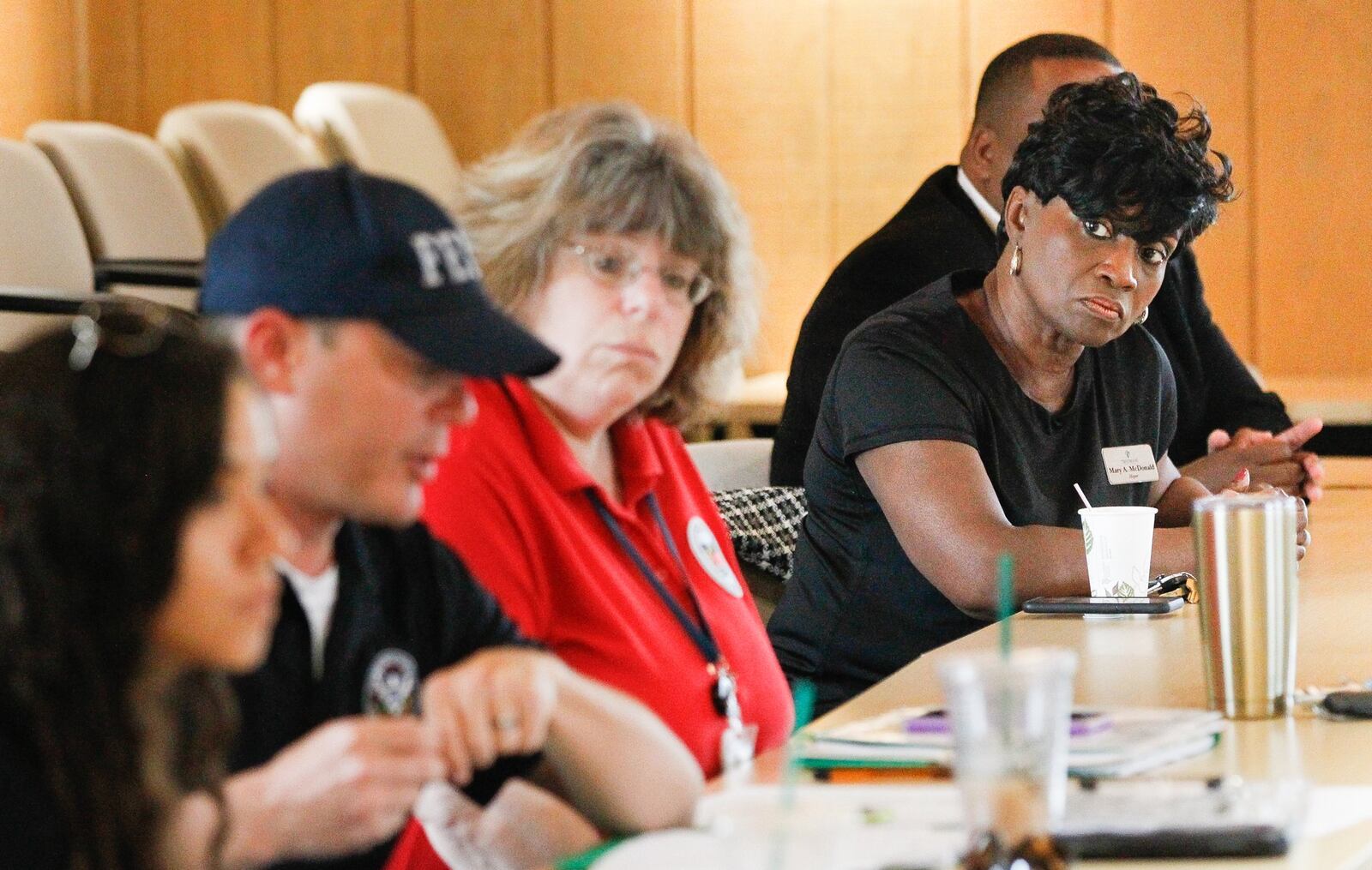 Trotwood Mayor Mary McDonald, right, listens during a briefing Wednesday before representatives of the Federal Emergency Management Agency, the Small Business Administration and the Ohio Emergency Management Agency conducted a joint preliminary assessment of tornado-damaged areas of Trotwood. CHRIS STEWART / STAFF