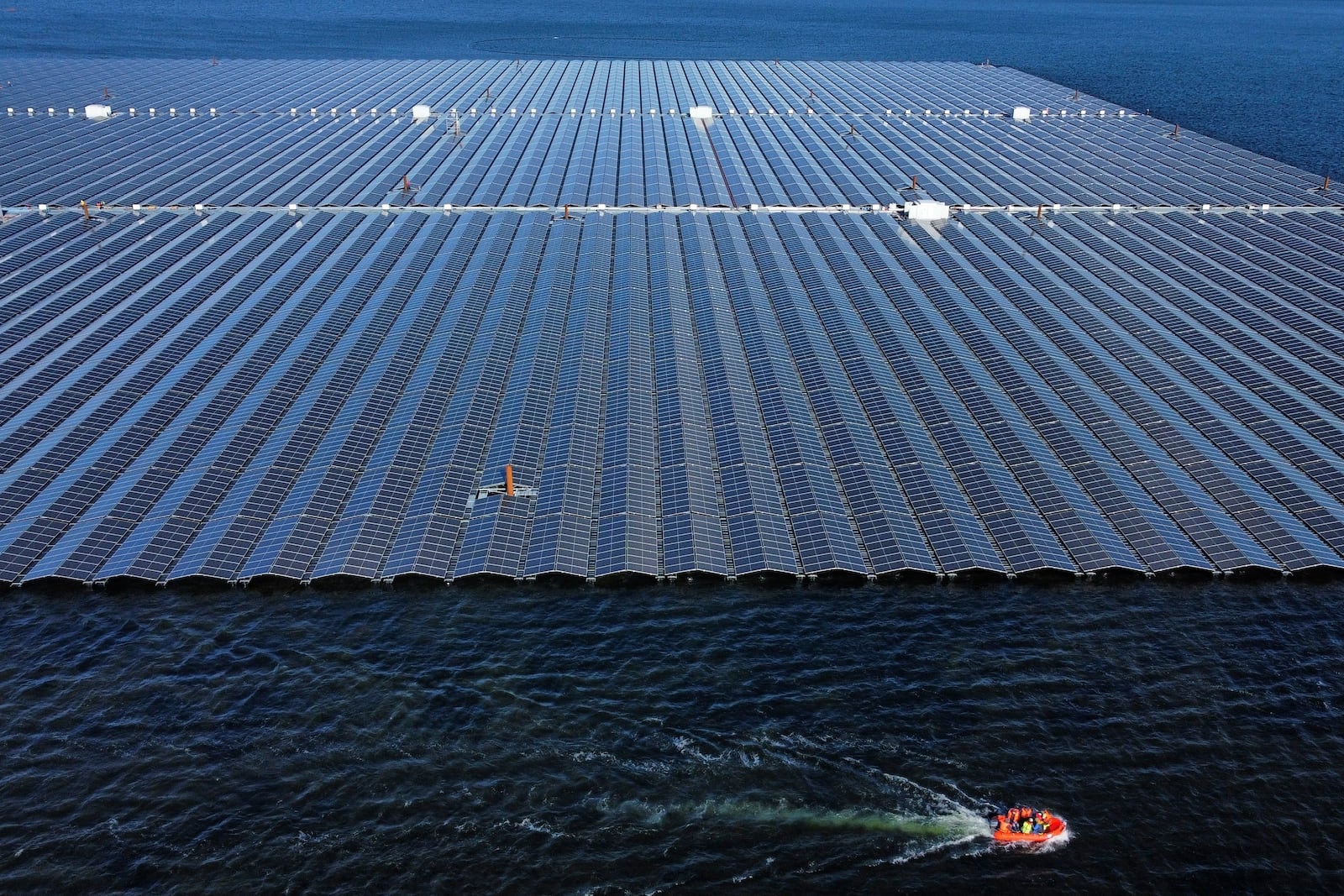 FILE - A floating solar farm operates on the Cottbuser Ostsee lake near Cottbus, Germany, Oct. 16, 2024. (AP Photo/Matthias Schrader, File)