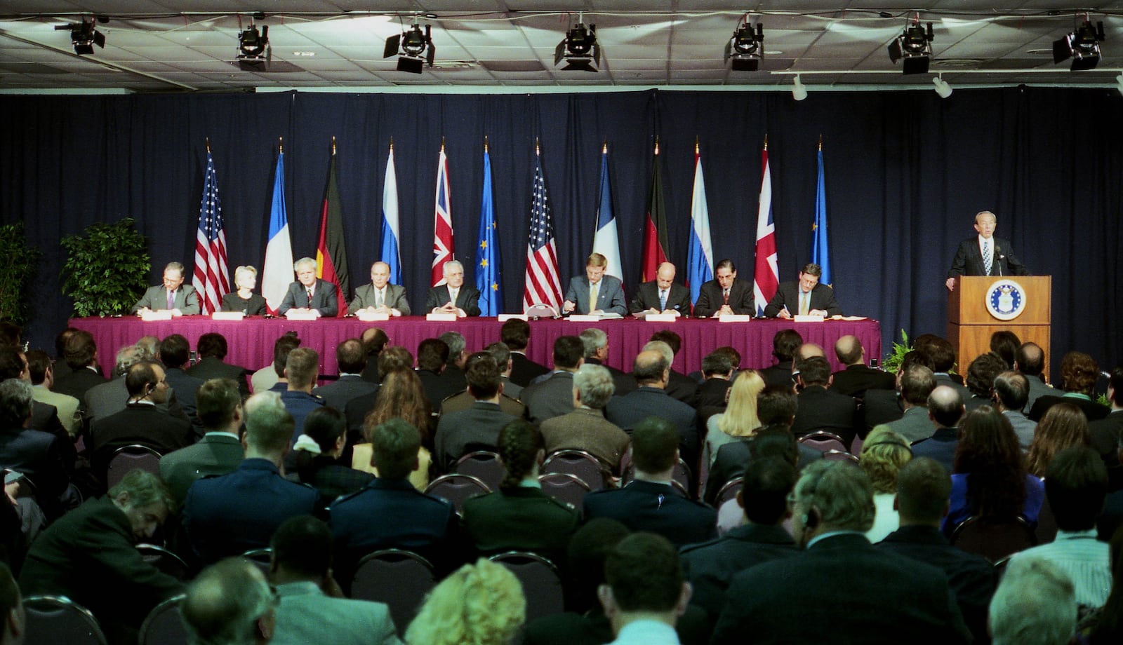 Secretary of State Warren Christopher, far right, addresses the gathering at the formal signing of the Dayton Agreement of the Bosnia Peace Talks on Nov. 21, 1995.   The 21 days of negotiations took place at Wright Patterson Air Force Base in Fairborn and the agreement was hammered out by Richard Holbrooke among the three principals,  President of the Federal Republic of Yugoslavia Slobodan Miloševic (representing the Bosnian Serb interests due to the absence of Karadžic), President of Croatia Franjo Tudman, and President of Bosnia and Herzegovina Alija Izetbegovic . © 1995 Skip Peterson/Dayton Daily News