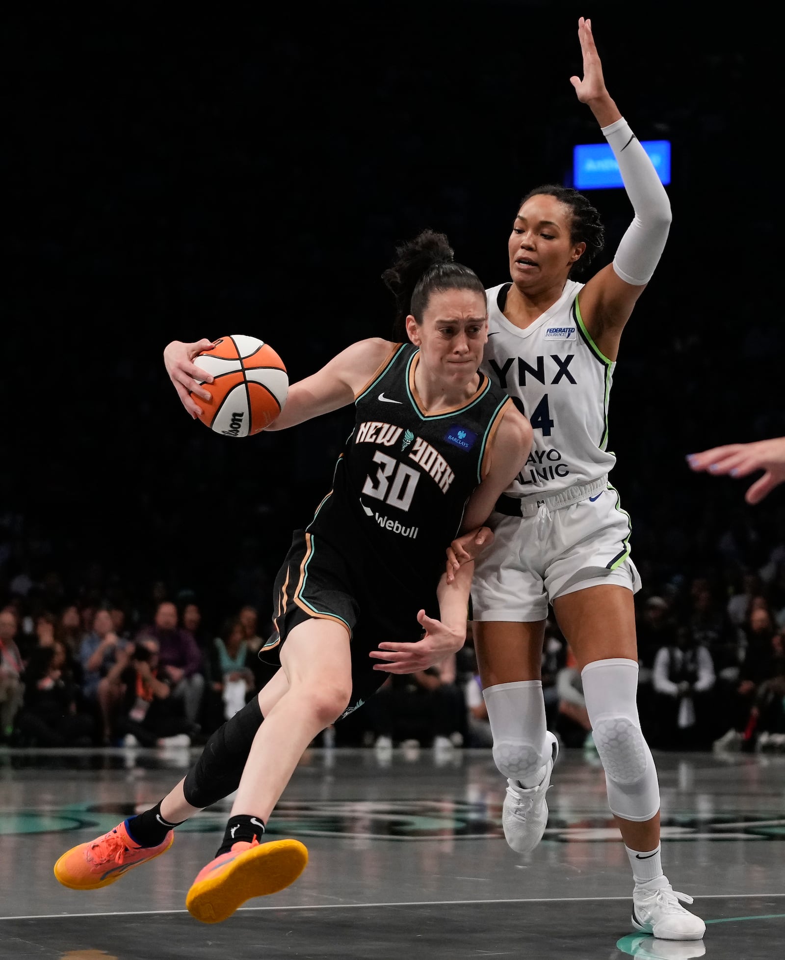 New York Liberty forward Breanna Stewart (30) drives against Minnesota Lynx forward Napheesa Collier (24) during the second quarter of Game 5 of the WNBA basketball final series, Sunday, Oct. 20, 2024, in New York. (AP Photo/Pamela Smith)